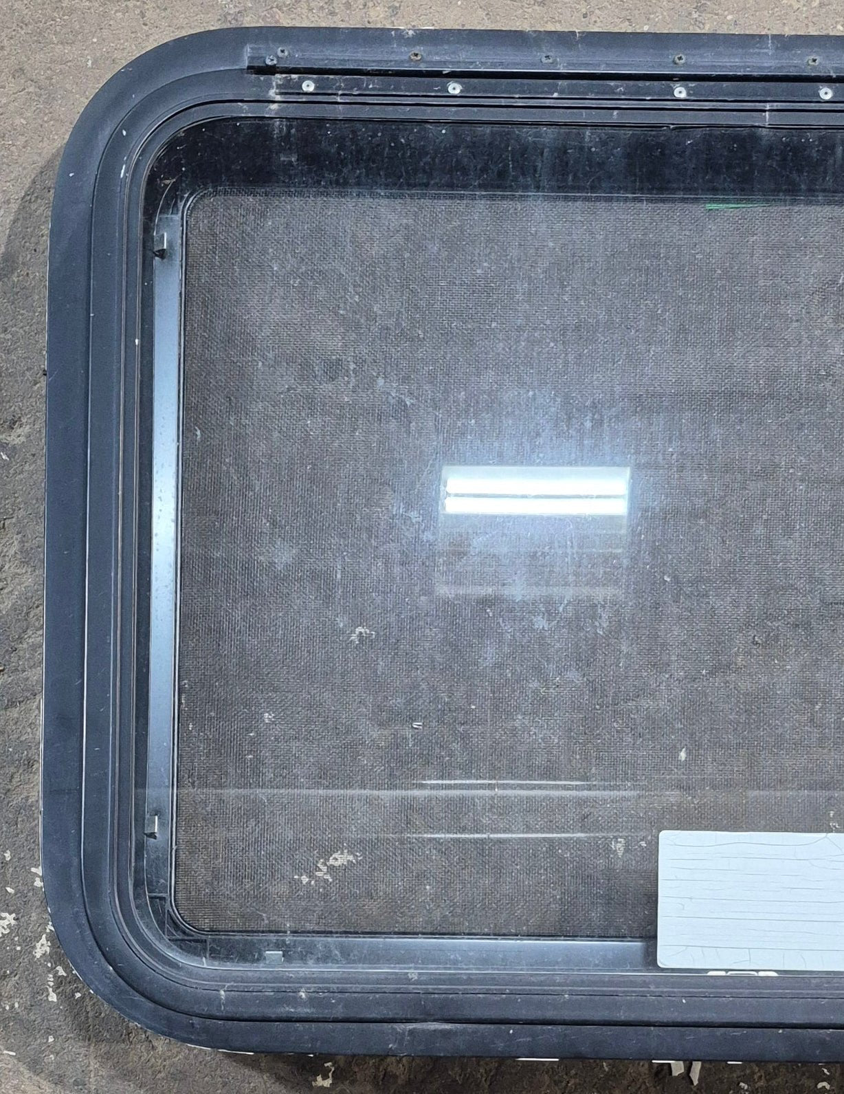 Used Black Radius Emergency Opening Window : 29 1/4" W x 21 1/4" H x 1 1/4" D - Young Farts RV Parts