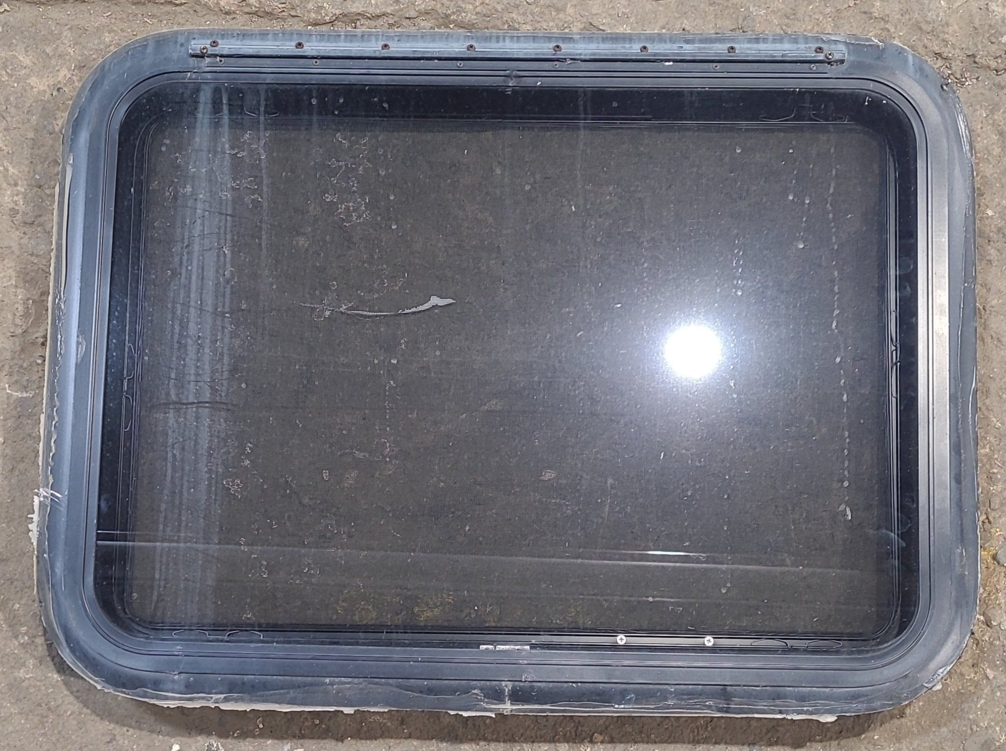 Used Black Radius Emergency Opening Window : 29 1/4" W x 21 1/4" H x 1 1/4" D - Young Farts RV Parts