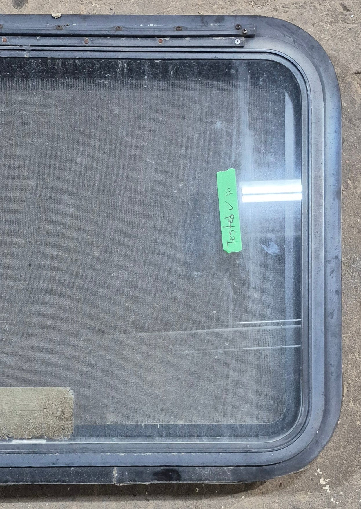 Used Black Radius Emergency Opening Window : 29 1/4" W x 21 1/4" H x 1 7/8" D - Young Farts RV Parts