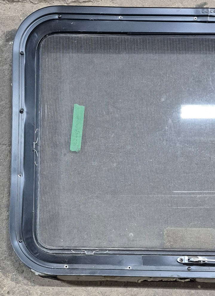 Used Black Radius Emergency Opening Window : 29 1/4" W x 21 1/4" H x 1 7/8" D - Young Farts RV Parts