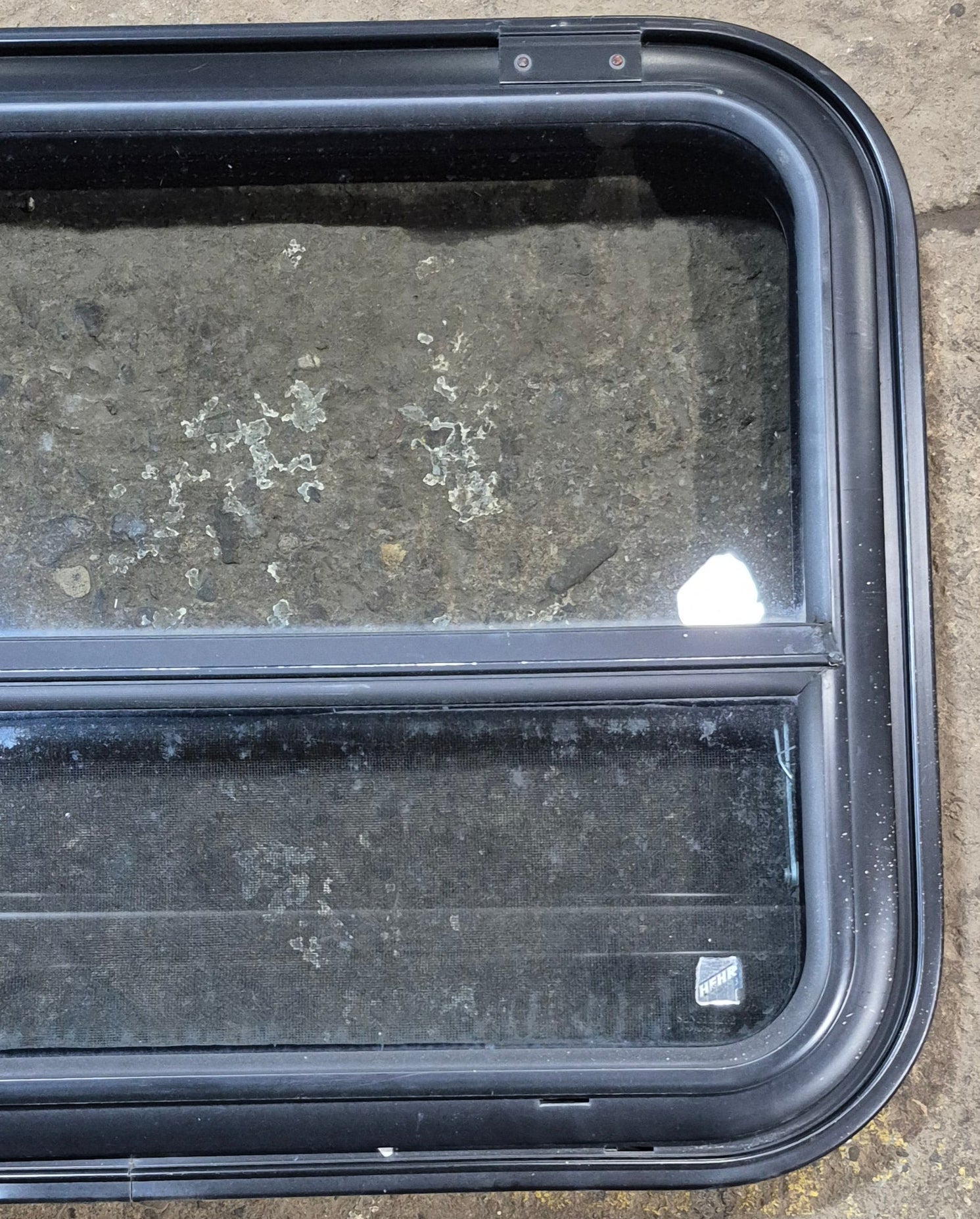 Used Black Radius Emergency Opening Window : 31 1/2" W x 23 1/2" H x 1 7/8" - Young Farts RV Parts