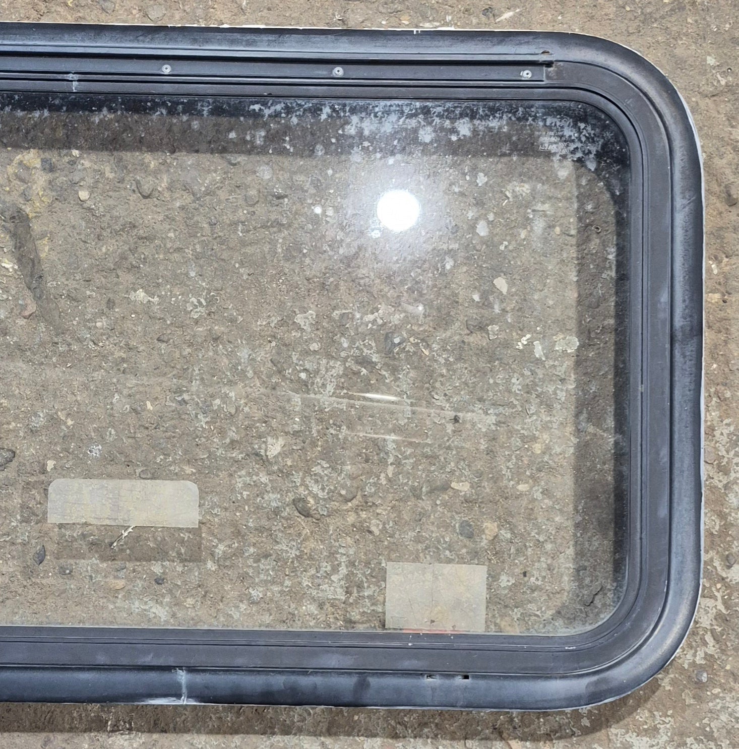 Used Black Radius Emergency Opening Window : 35 1/2" W x 18 1/2" H x 1 7/8" - Young Farts RV Parts