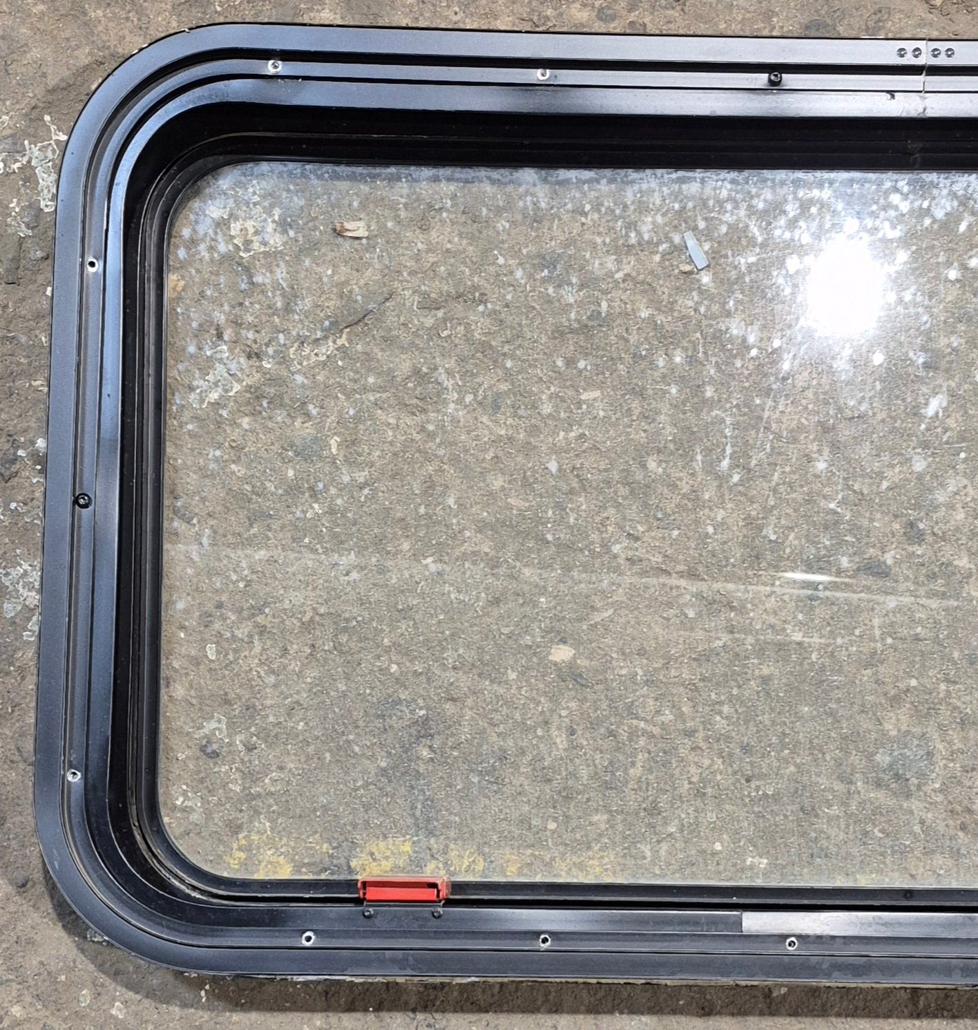 Used Black Radius Emergency Opening Window : 35 1/2" W x 18 1/2" H x 1 7/8" - Young Farts RV Parts