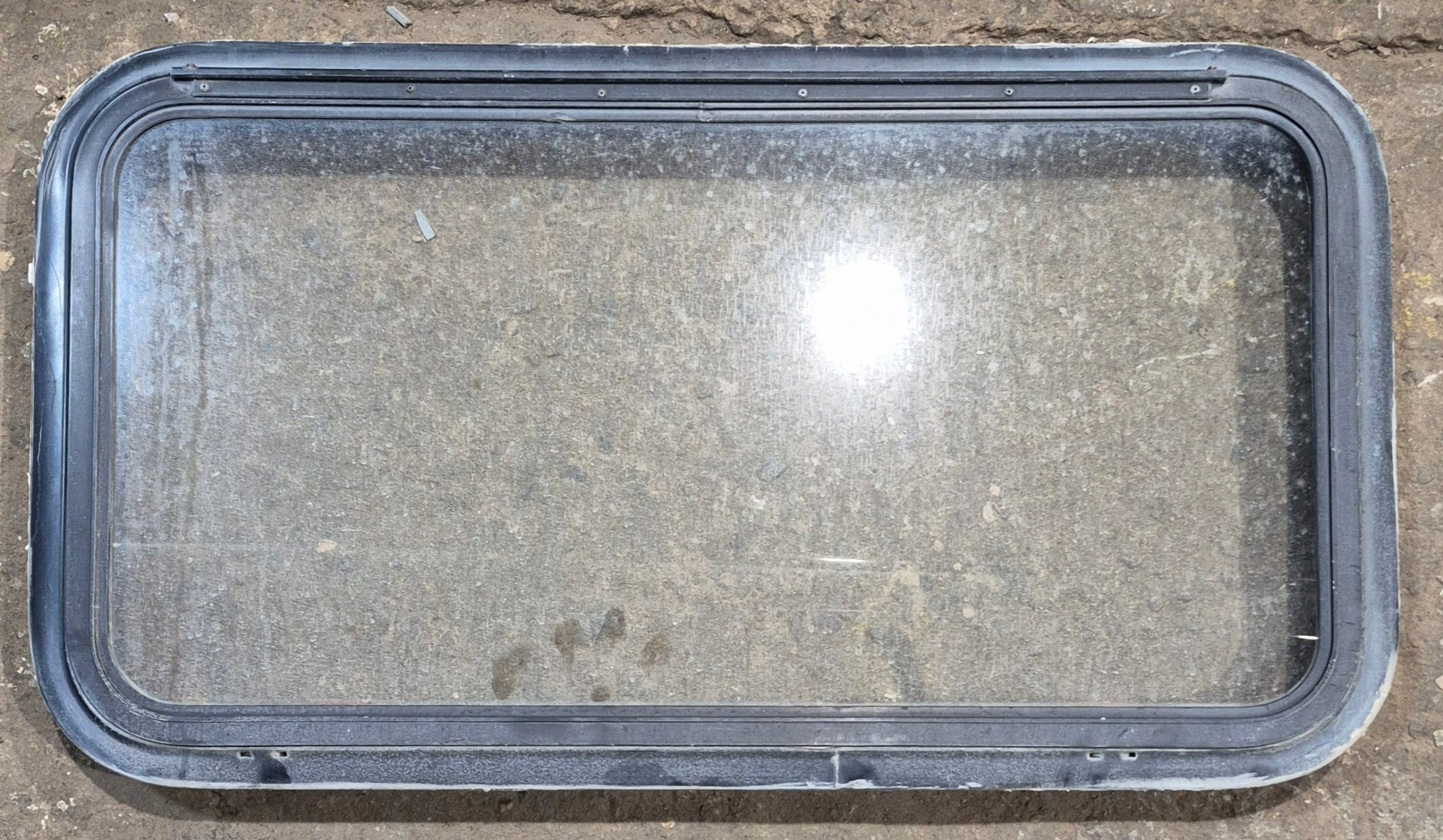 Used Black Radius Emergency Opening Window : 35 1/2" W x 18 1/2" H x 1 7/8" - Young Farts RV Parts