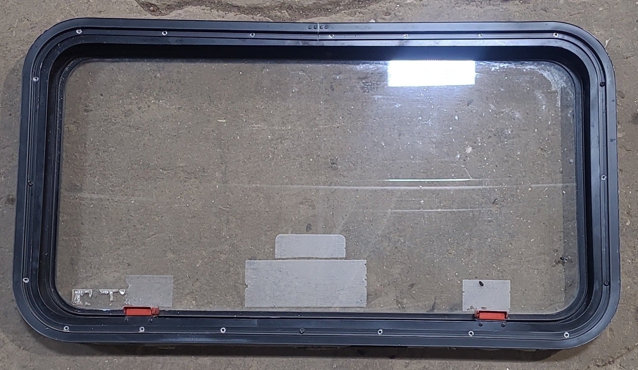 Used Black Radius Emergency Opening Window : 35 1/2" W x 18 1/2" H x 1 7/8" D - Young Farts RV Parts