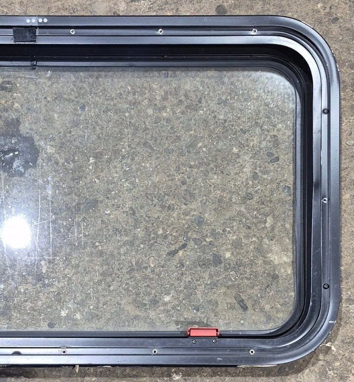Used Black Radius Emergency Opening Window : 35 1/2" W x 18 3/4" H x 1 7/8" - Young Farts RV Parts
