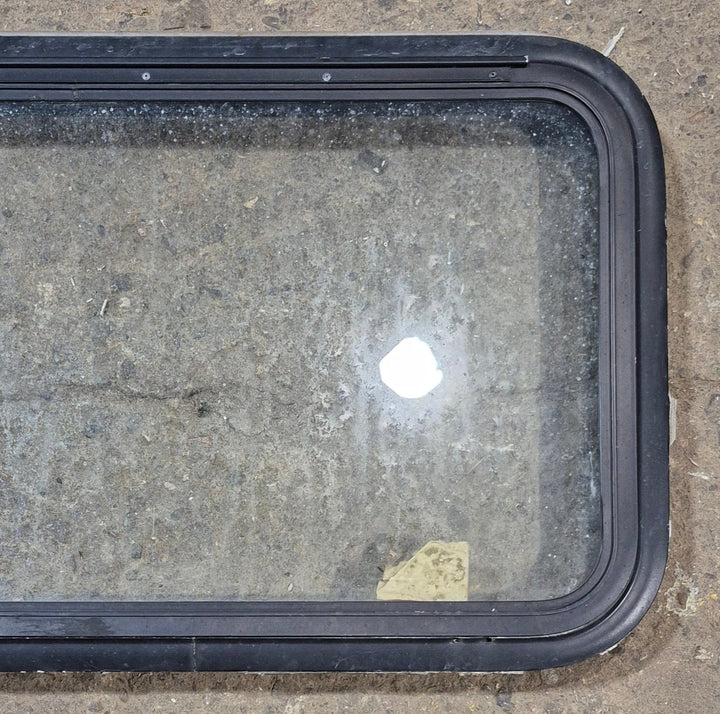 Used Black Radius Emergency Opening Window : 35 1/4" W x 18 1/2" H x 1 7/8" - Young Farts RV Parts