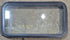 Used Black Radius Emergency Opening Window : 35 1/4" W x 18 1/2" H x 1 7/8" - Young Farts RV Parts