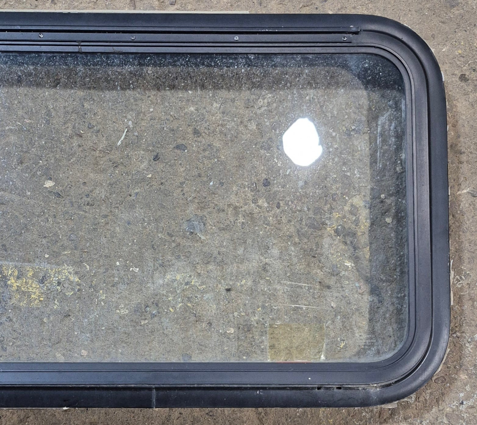 Used Black Radius Emergency Opening Window : 35 1/4" W x 18 1/2" H x 1 7/8" - Young Farts RV Parts