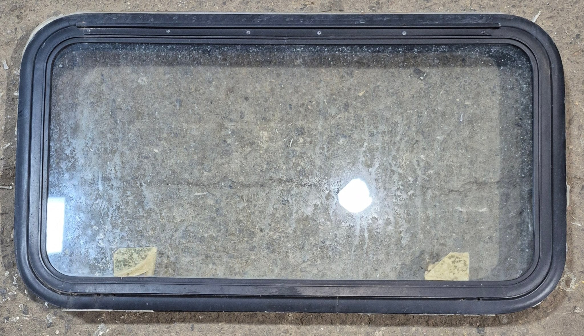 Used Black Radius Emergency Opening Window : 35 1/4" W x 18 1/2" H x 1 7/8" - Young Farts RV Parts
