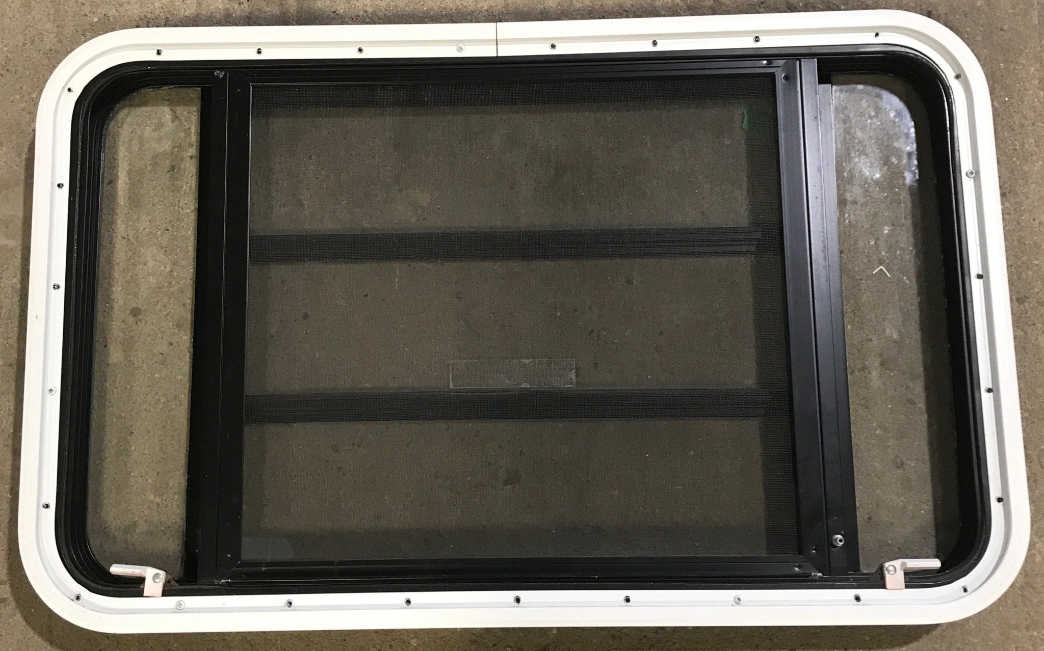Used Black Radius Emergency Opening Window : 35 1/4" W x 21 1/4" H x 1 7/8" D - Young Farts RV Parts