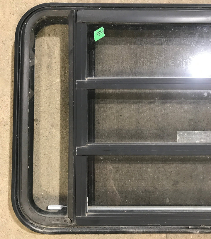 Used Black Radius Emergency Opening Window : 35 1/4" W x 21 1/4" H x 1 7/8" D - Young Farts RV Parts
