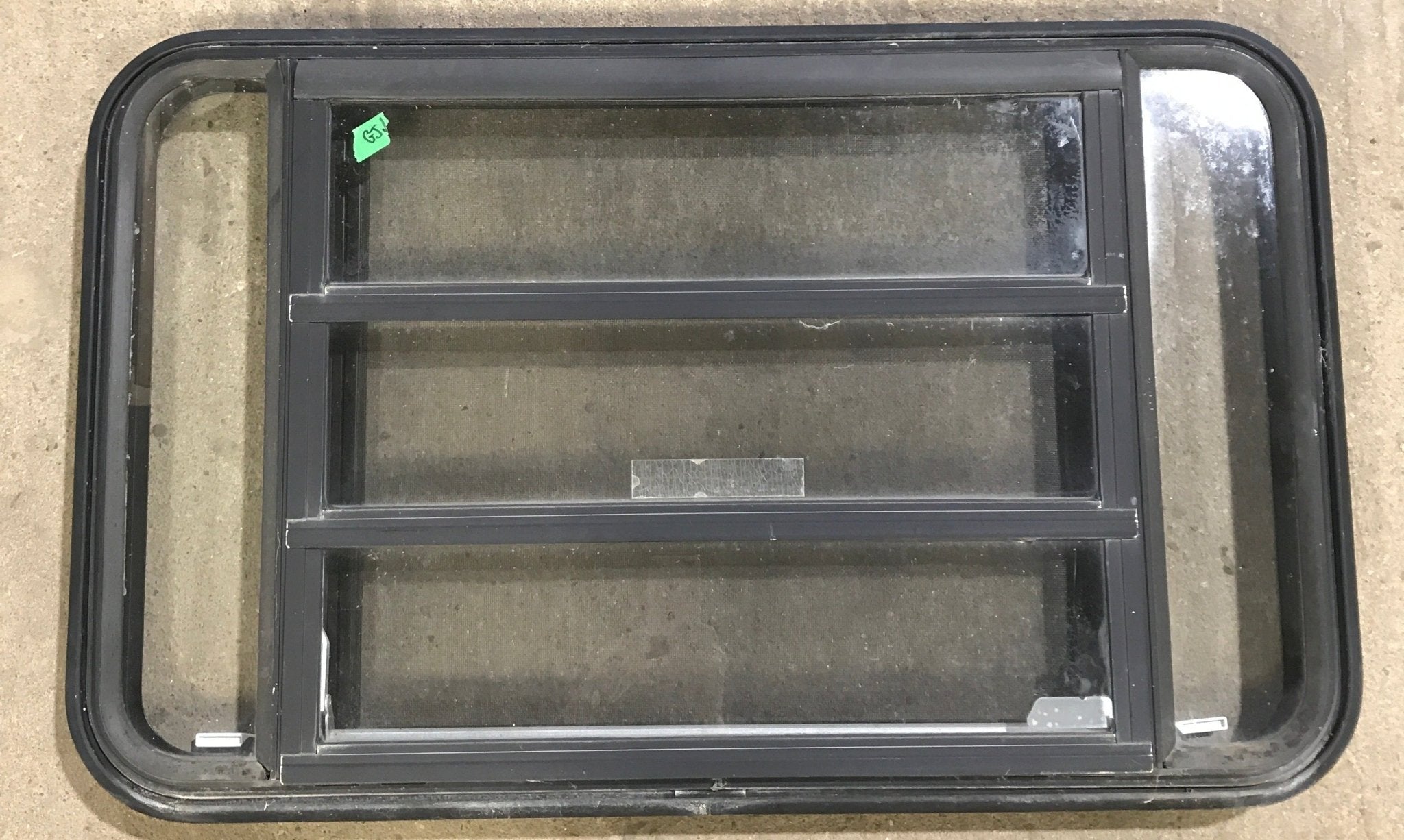 Used Black Radius Emergency Opening Window : 35 1/4" W x 21 1/4" H x 1 7/8" D - Young Farts RV Parts