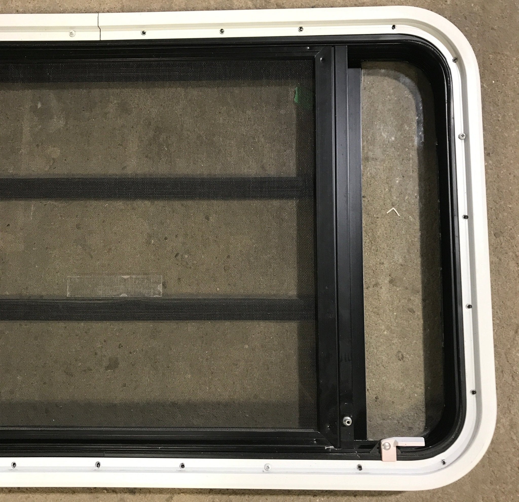 Used Black Radius Emergency Opening Window : 35 1/4" W x 21 1/4" H x 1 7/8" D - Young Farts RV Parts