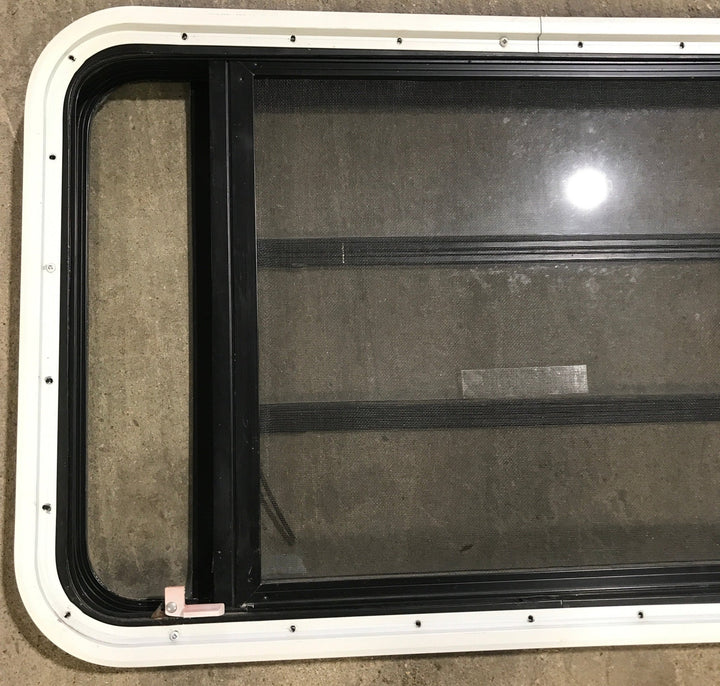 Used Black Radius Emergency Opening Window : 35" W x 21 1/4" H x 1 7/8" D - Young Farts RV Parts