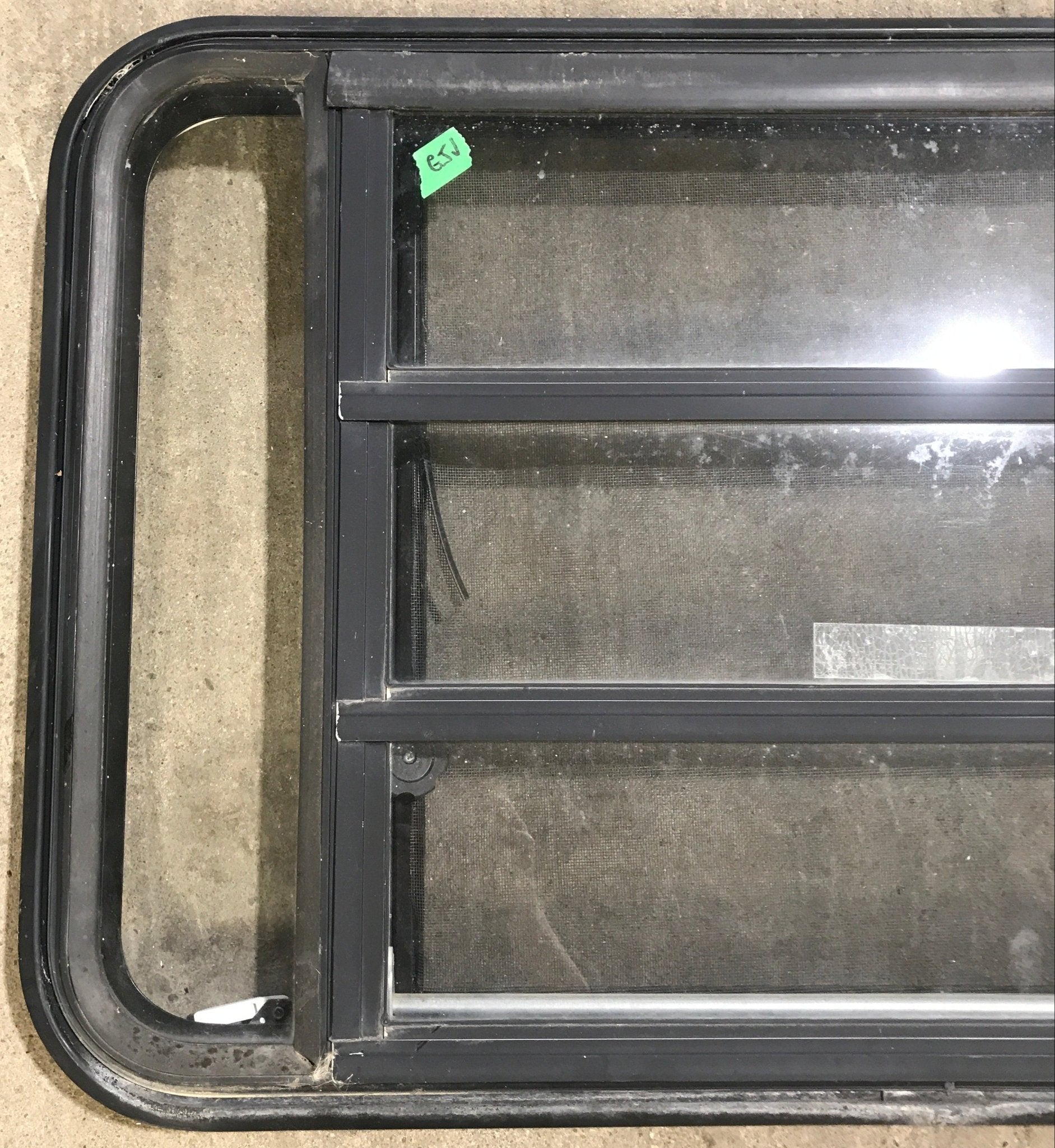 Used Black Radius Emergency Opening Window : 35" W x 21 1/4" H x 1 7/8" D - Young Farts RV Parts