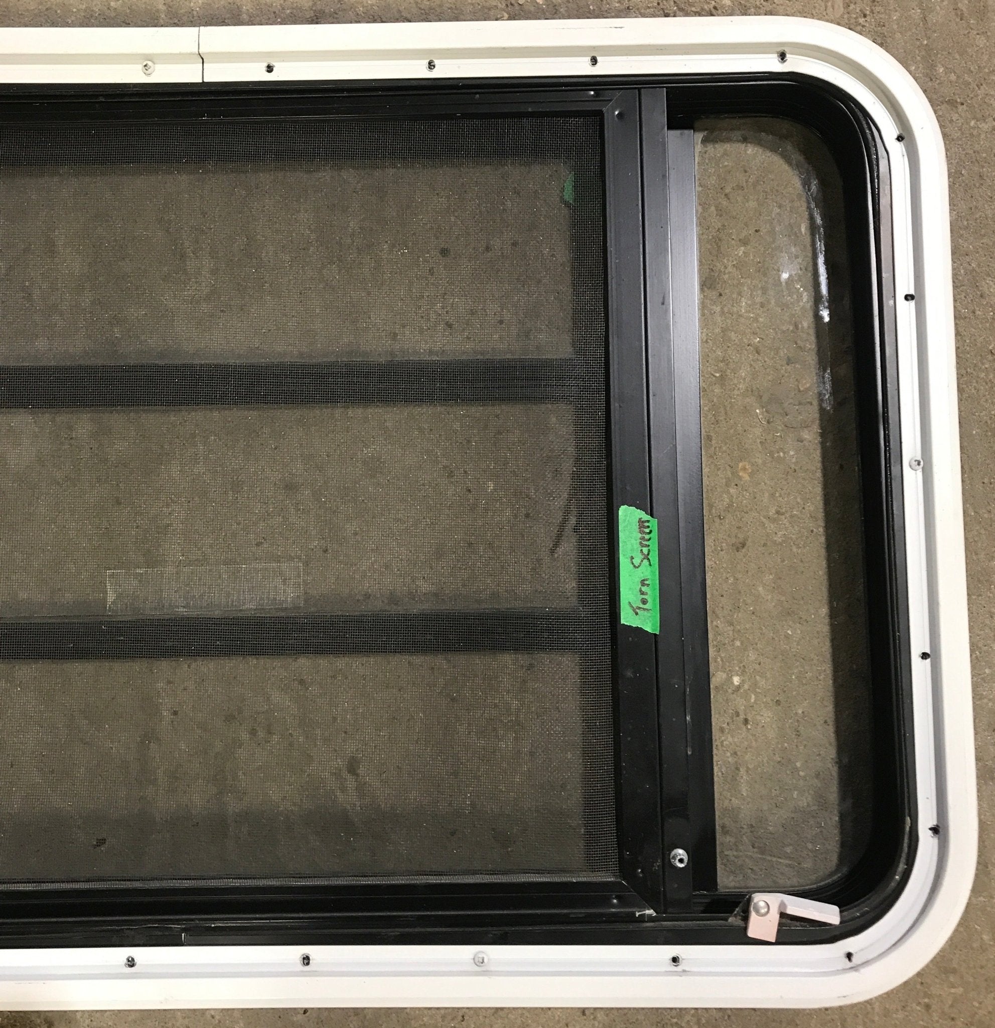 Used Black Radius Emergency Opening Window : 35" W x 21 1/4" H x 1 7/8" D - Young Farts RV Parts