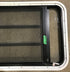Used Black Radius Emergency Opening Window : 35" W x 21 1/4" H x 1 7/8" D - Young Farts RV Parts