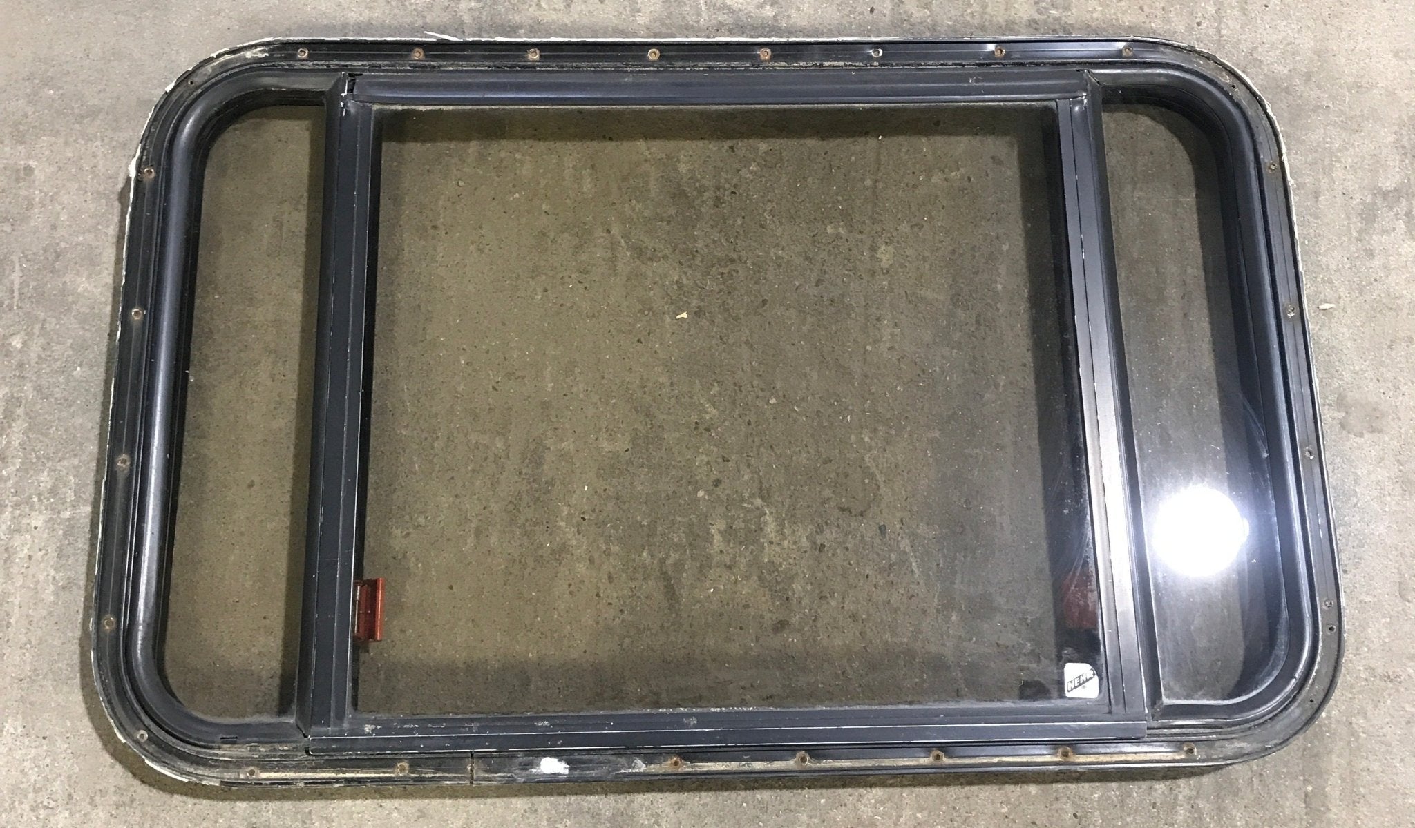 Used Black Radius Emergency Opening Window : 36 1/2" W x 23 1/2" H x 1 1/2" - Young Farts RV Parts