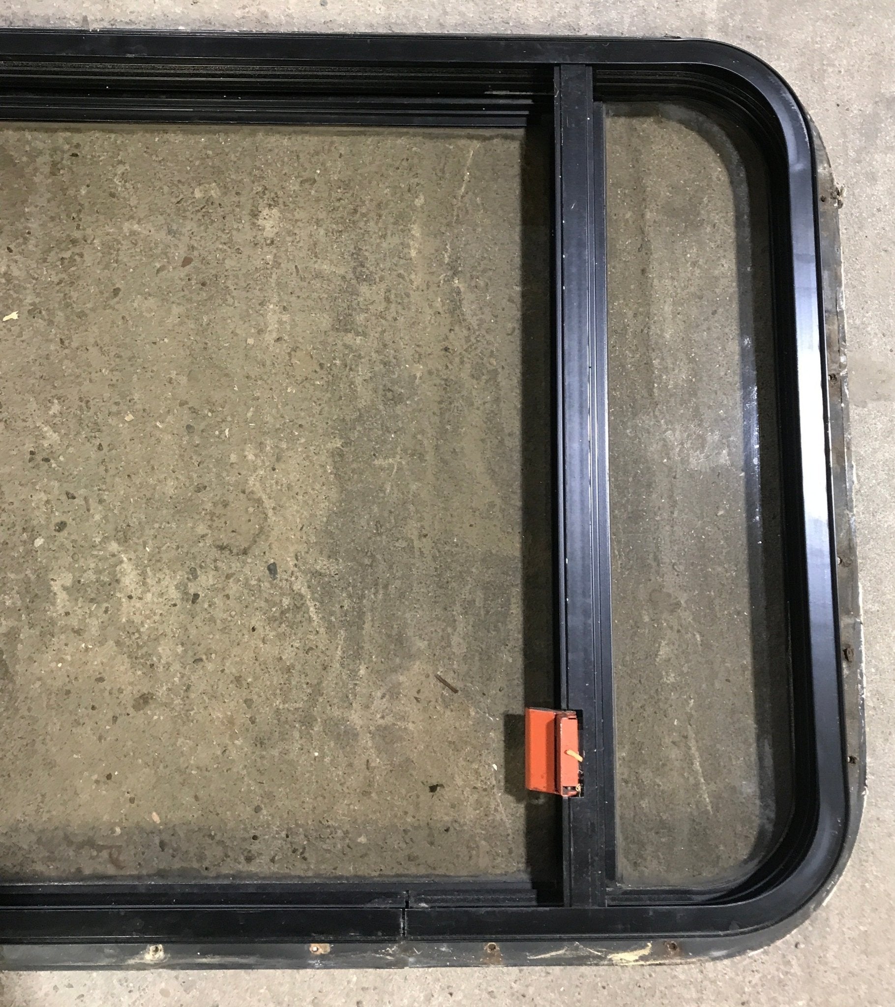 Used Black Radius Emergency Opening Window : 36 1/2" W x 23 1/2" H x 1 1/2" - Young Farts RV Parts