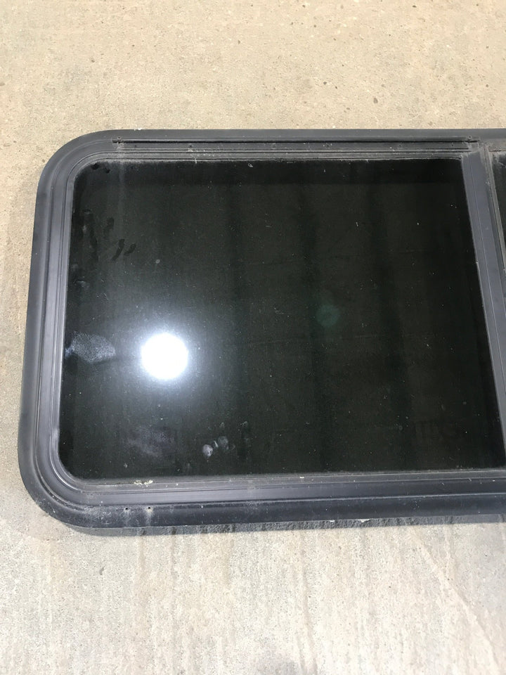 Used Black Radius Emergency Opening Window : 41 1/2" W x 21 1/2" H x 1 7/8" - Young Farts RV Parts