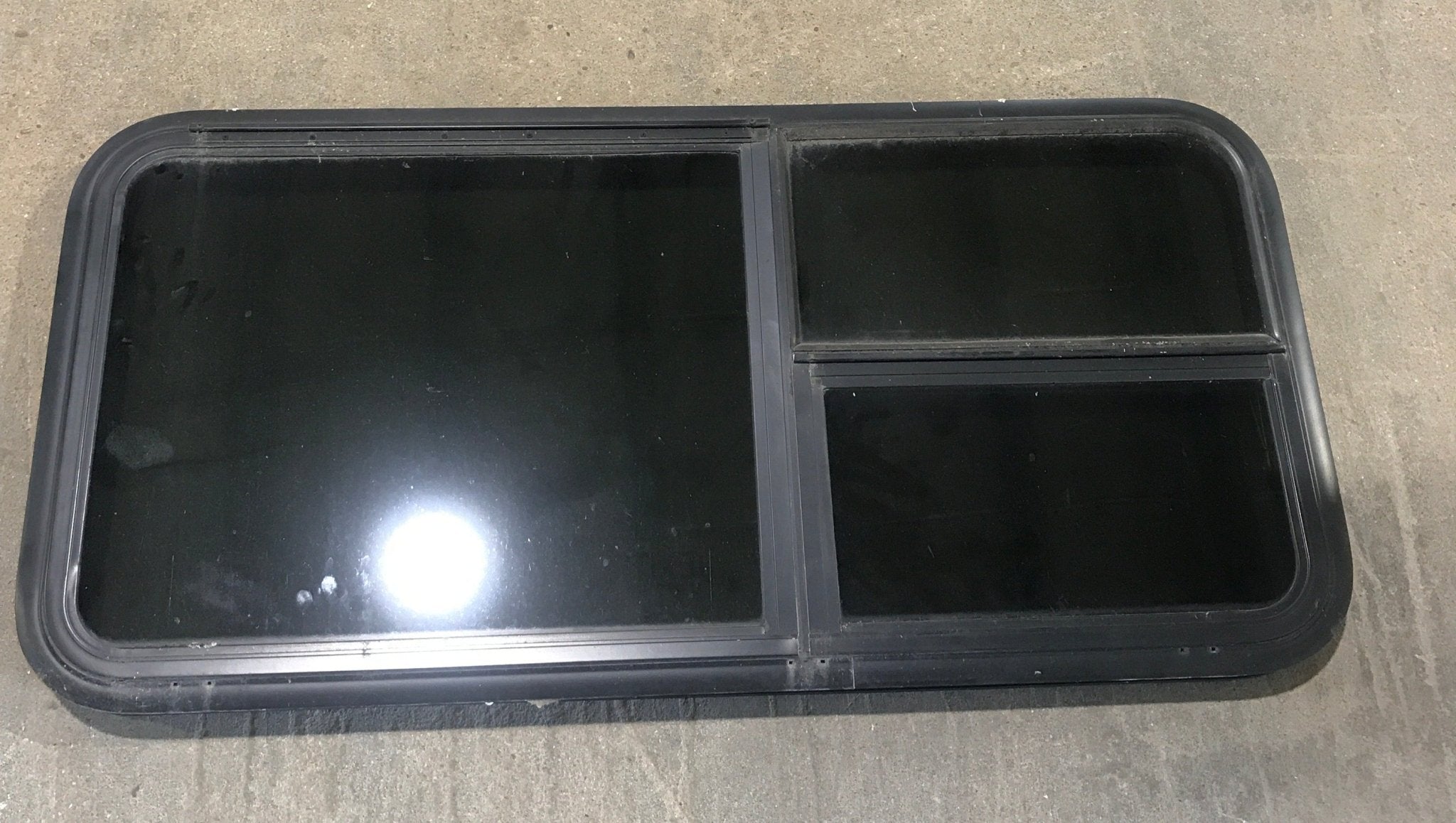 Used Black Radius Emergency Opening Window : 41 1/2" W x 21 1/2" H x 1 7/8" - Young Farts RV Parts