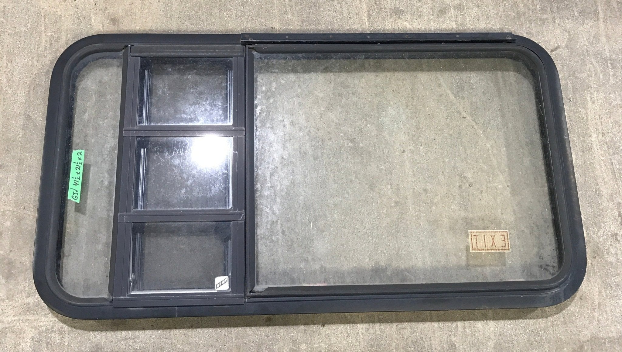 Used Black Radius Emergency Opening Window : 41 1/2" W x 21 1/2" H x 2" D - Young Farts RV Parts
