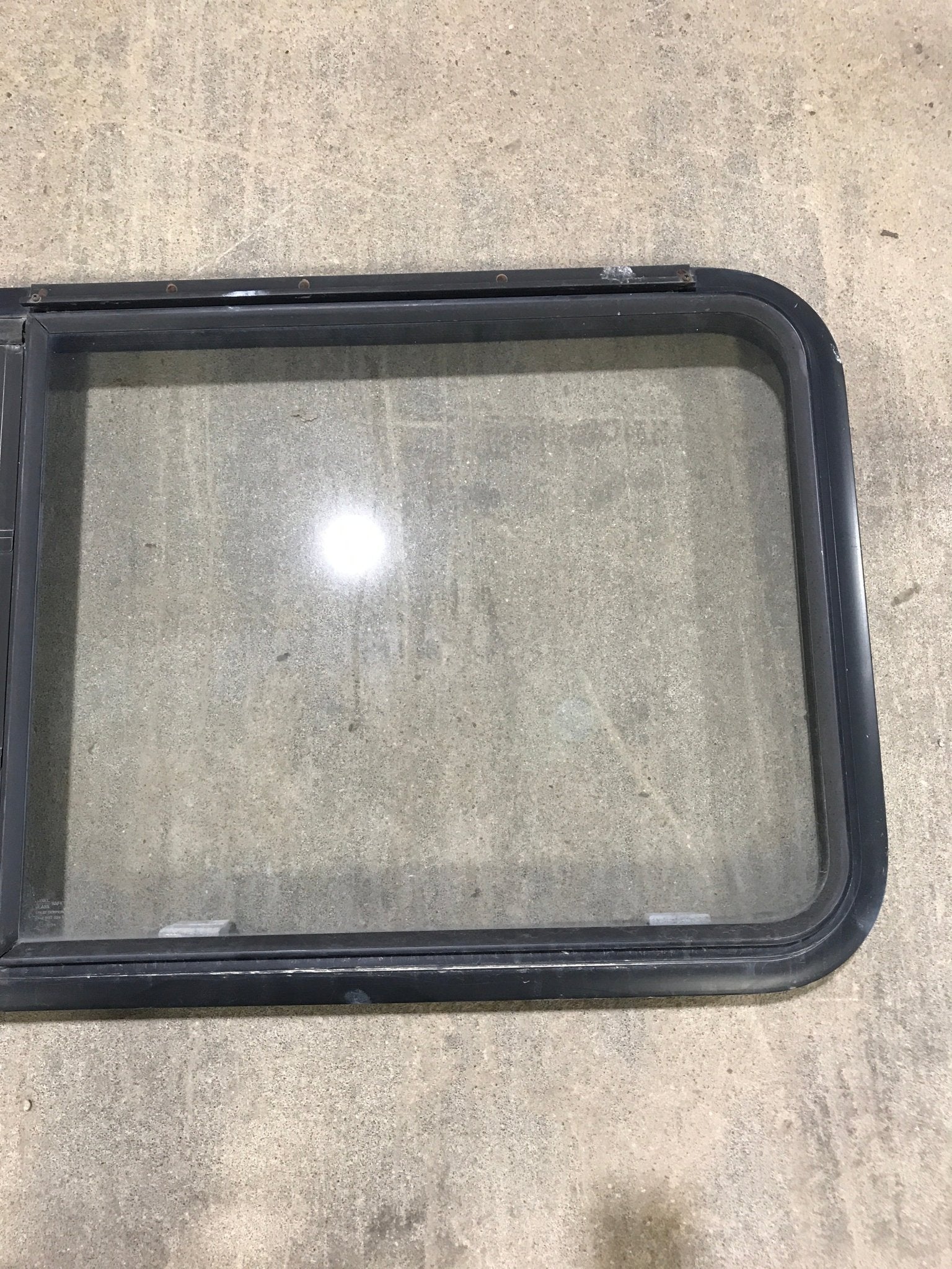 Used Black Radius Emergency Opening Window : 41 1/2" W x 21 1/2" H x 2" D - Young Farts RV Parts