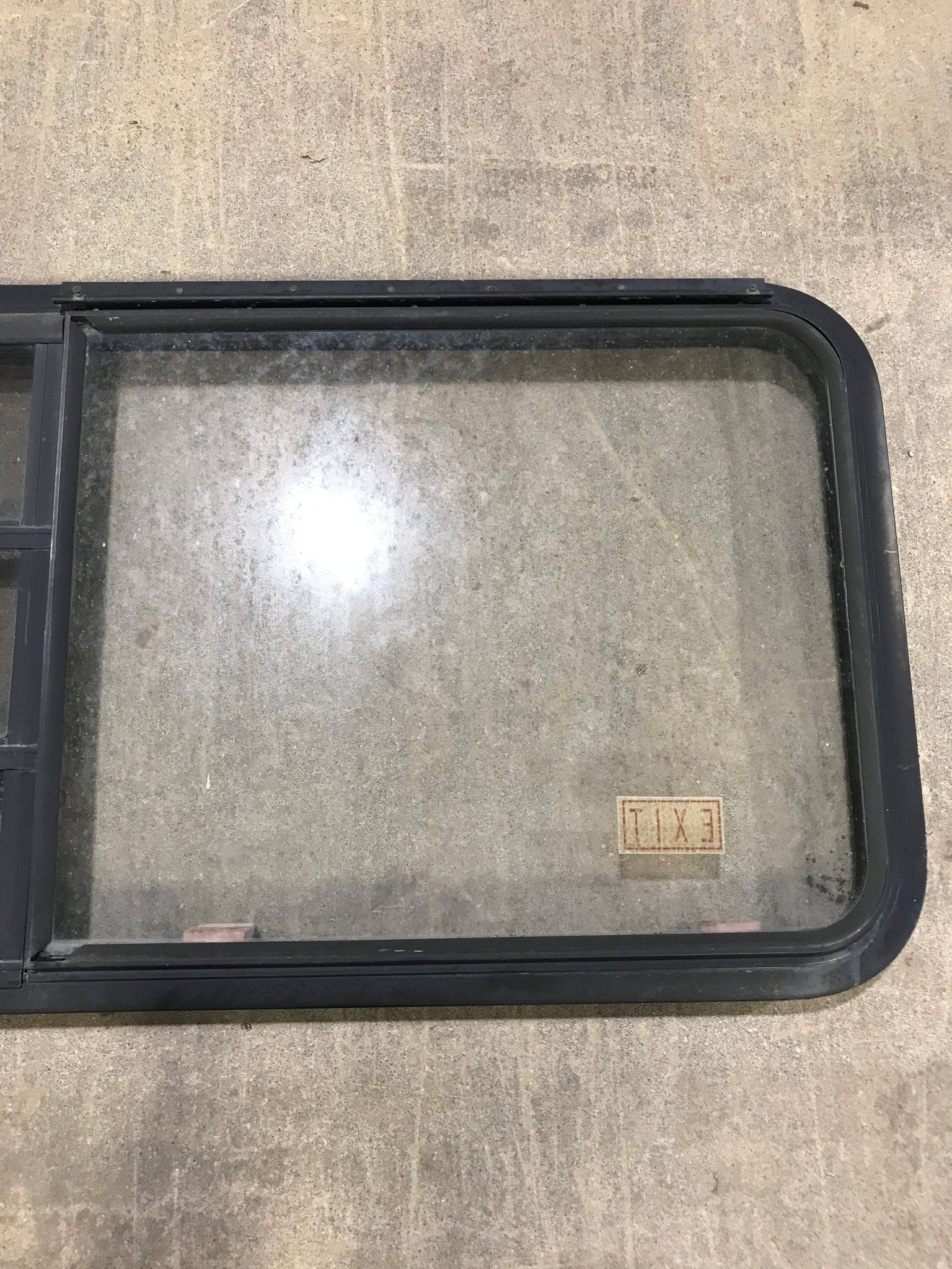 Used Black Radius Emergency Opening Window : 41 1/2" W x 21 1/2" H x 2" D - Young Farts RV Parts
