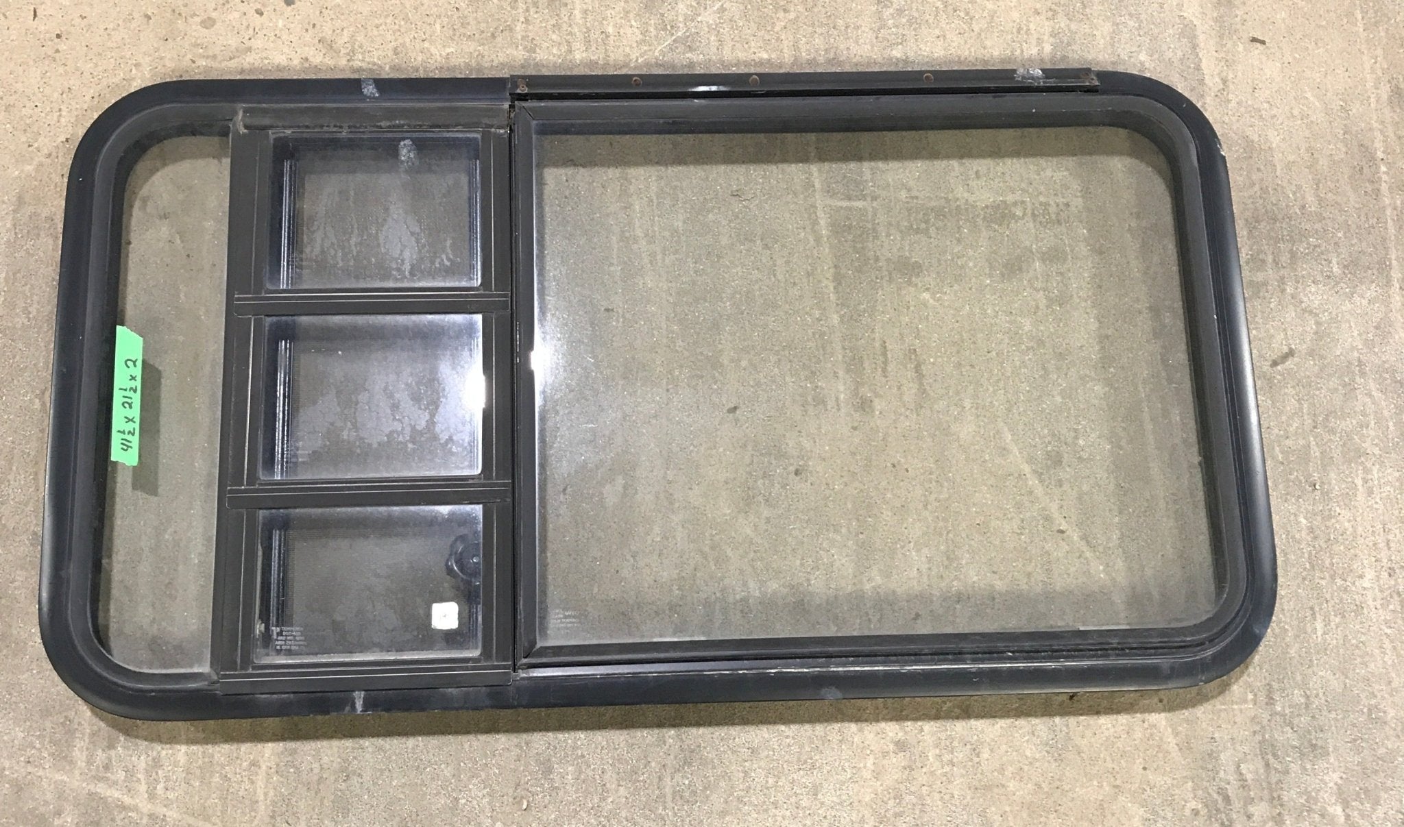 Used Black Radius Emergency Opening Window : 41 1/2" W x 21 1/2" H x 2" D - Young Farts RV Parts