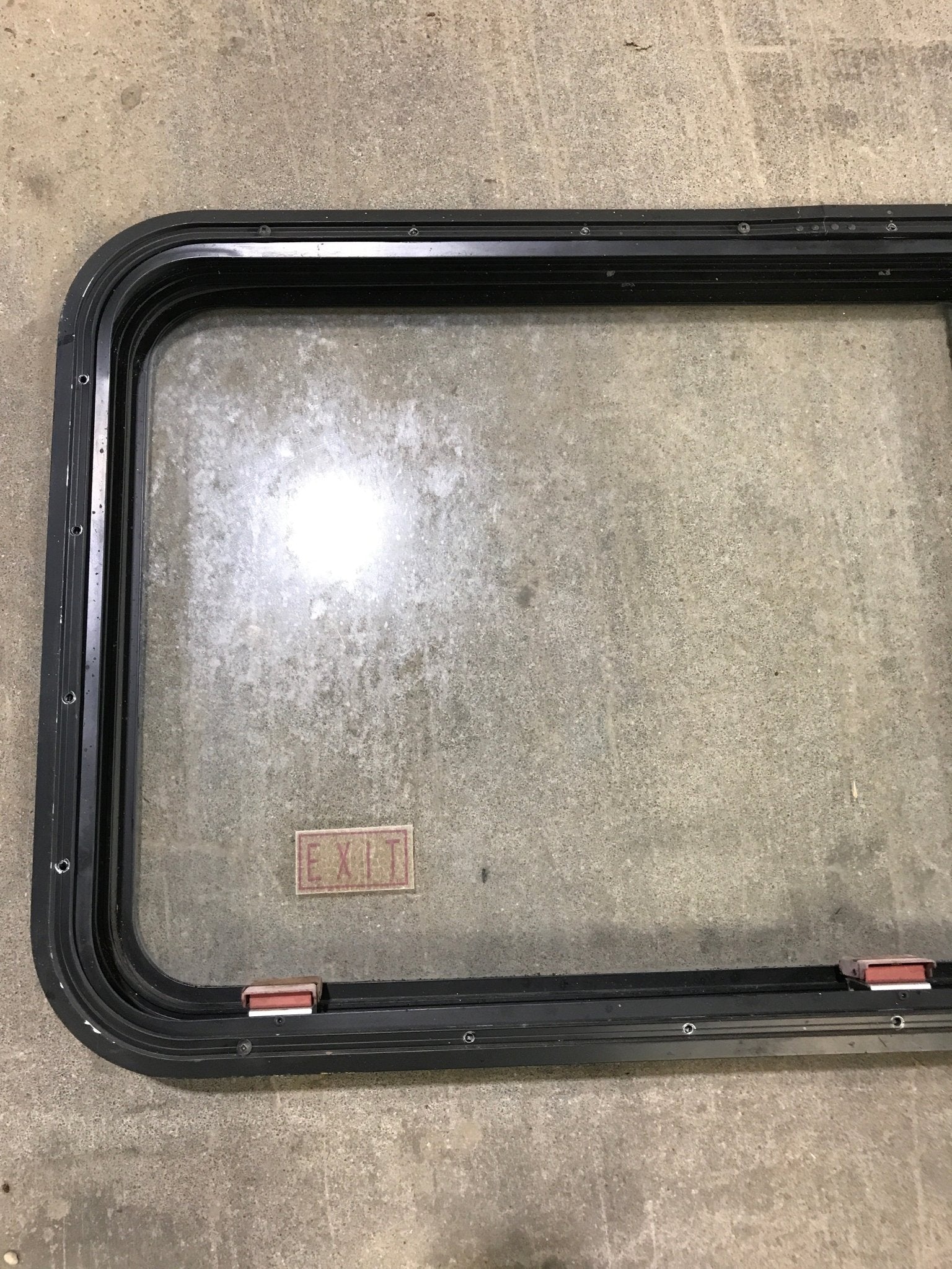 Used Black Radius Emergency Opening Window : 41 1/2" W x 21 1/2" H x 2" D - Young Farts RV Parts