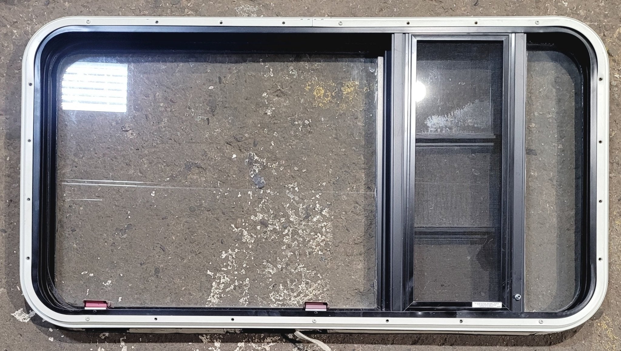 Used Black Radius Emergency Opening Window : 41 1/2" W x 21 3/4" H x 1 1/4" D - Young Farts RV Parts