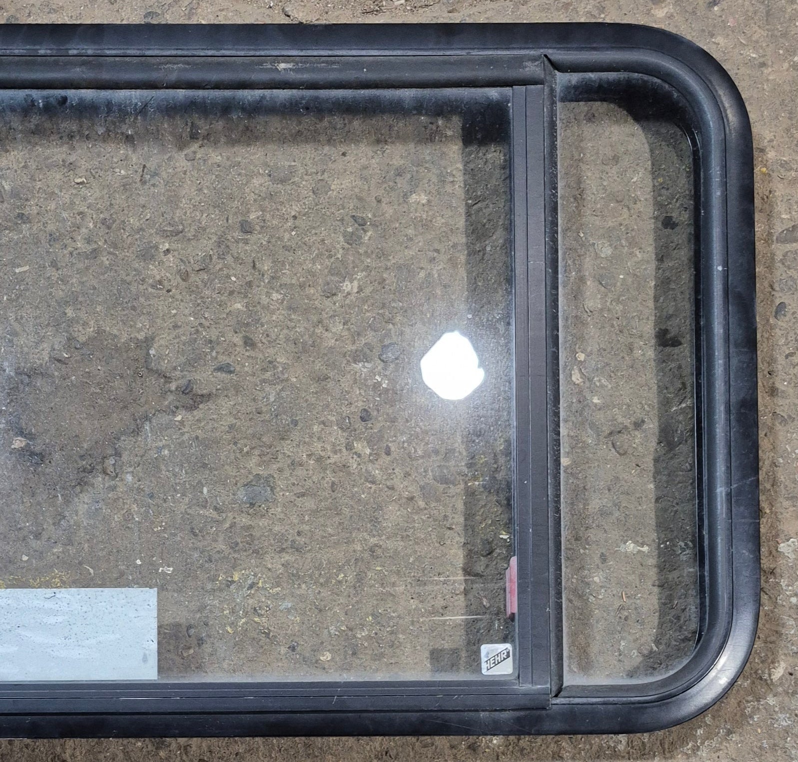 Used Black Radius Emergency Opening Window : 41 1/2" W x 21 3/4" H x 1 7/8" - Young Farts RV Parts