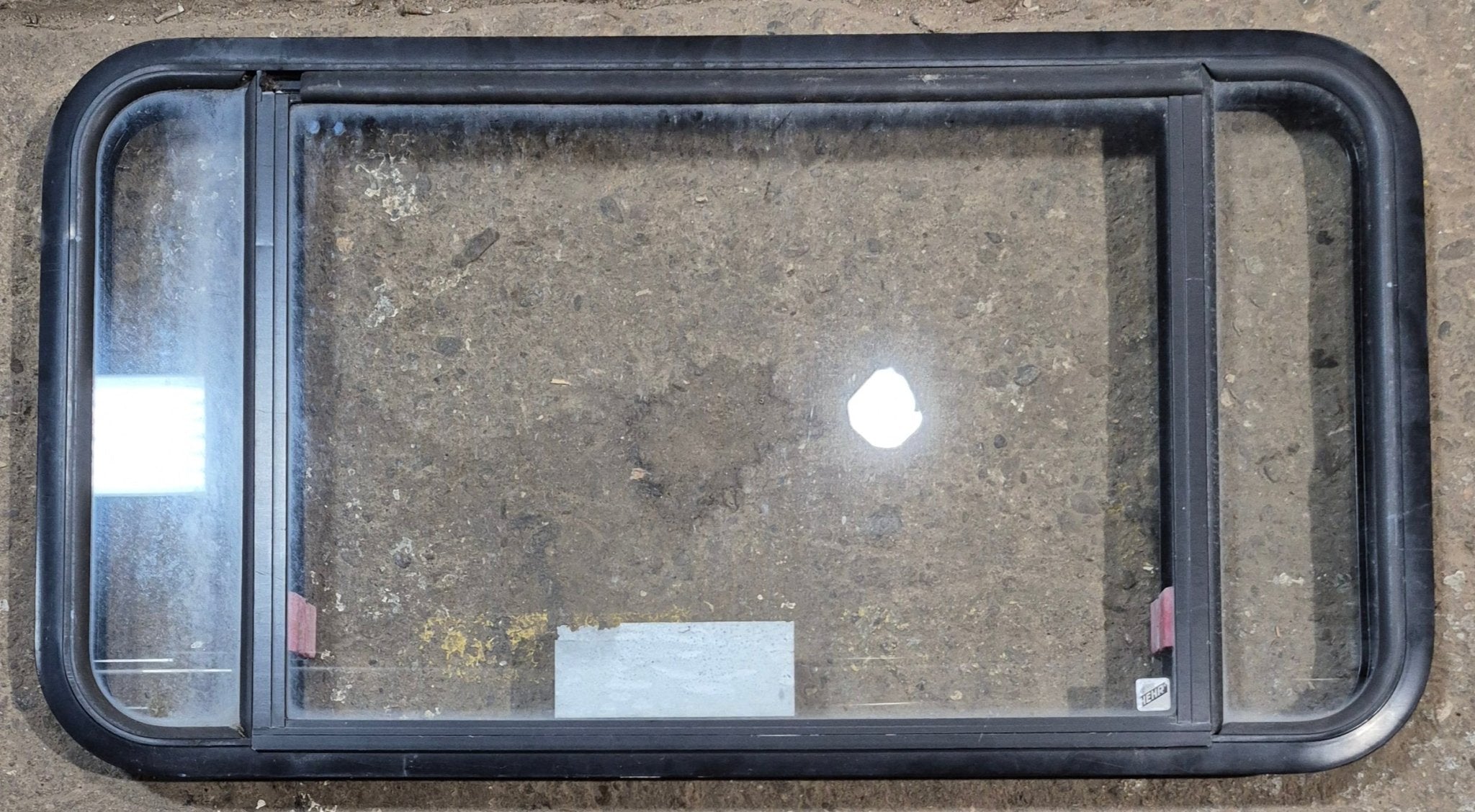 Used Black Radius Emergency Opening Window : 41 1/2" W x 21 3/4" H x 1 7/8" - Young Farts RV Parts