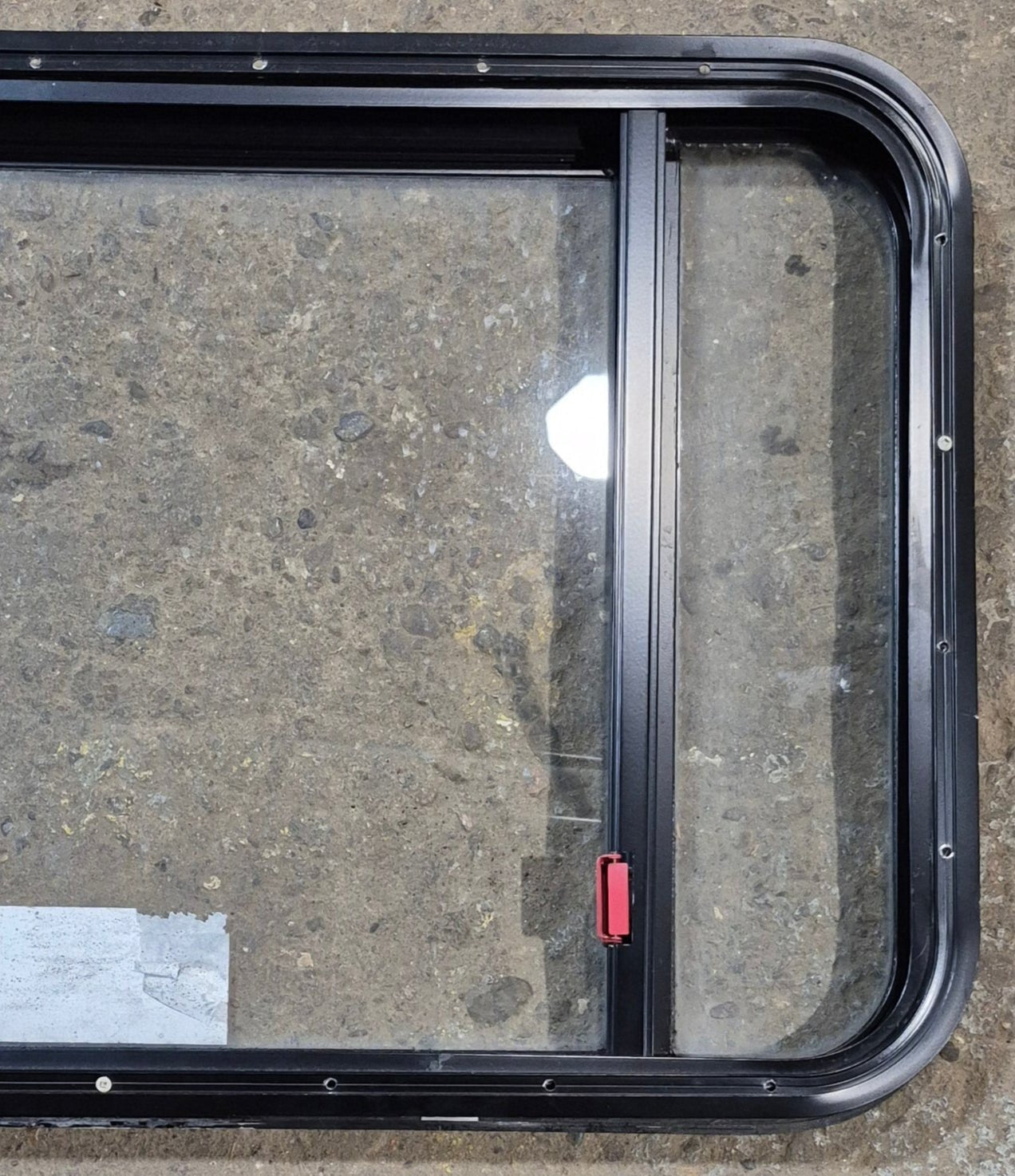 Used Black Radius Emergency Opening Window : 41 1/2" W x 21 3/4" H x 1 7/8" - Young Farts RV Parts