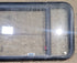 Used Black Radius Emergency Opening Window : 47 1/2" W x 21 1/2" H x 1 3/4" - Young Farts RV Parts