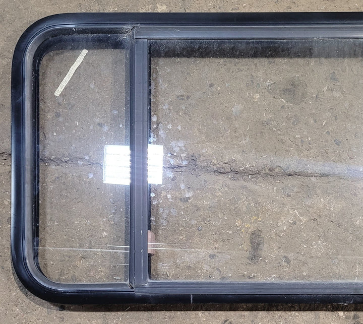 Used Black Radius Emergency Opening Window : 47 1/2" W x 21 1/2" H x 1 3/4" - Young Farts RV Parts