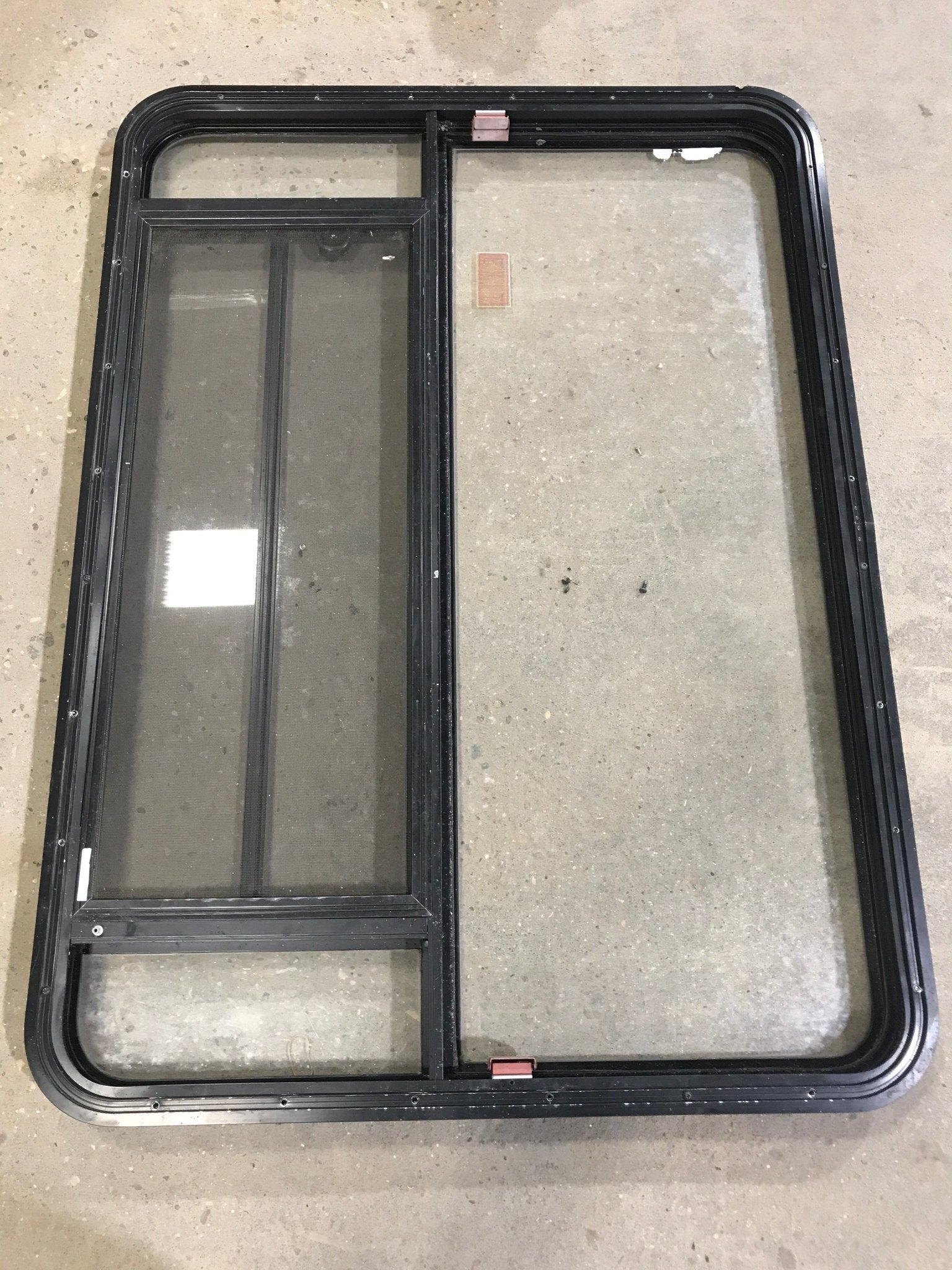 Used Black Radius Emergency Opening Window : 47 1/2" W x 34 1/2" H x 2" D - Young Farts RV Parts
