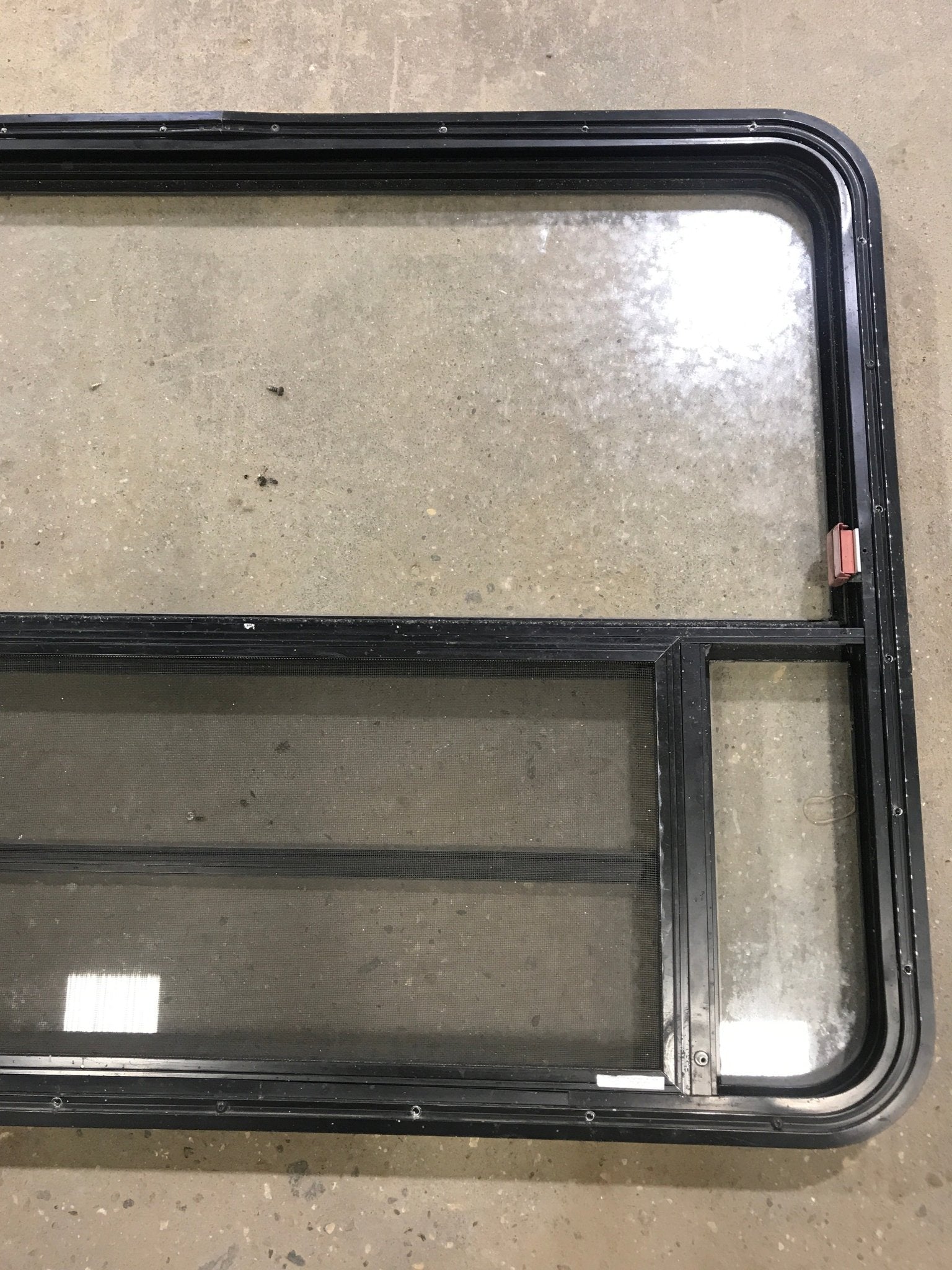 Used Black Radius Emergency Opening Window : 47 1/2" W x 34 1/2" H x 2" D - Young Farts RV Parts