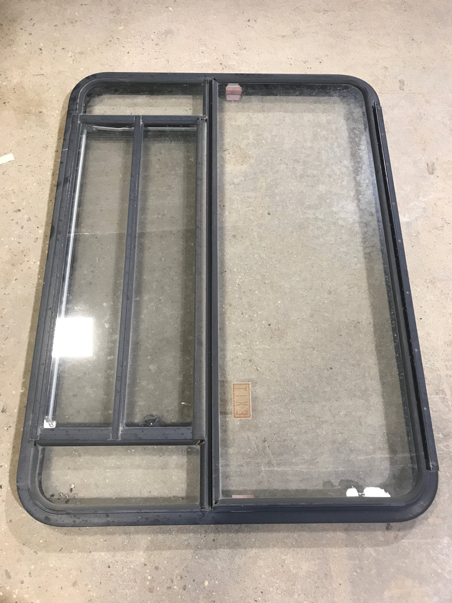 Used Black Radius Emergency Opening Window : 47 1/2" W x 34 1/2" H x 2" D - Young Farts RV Parts