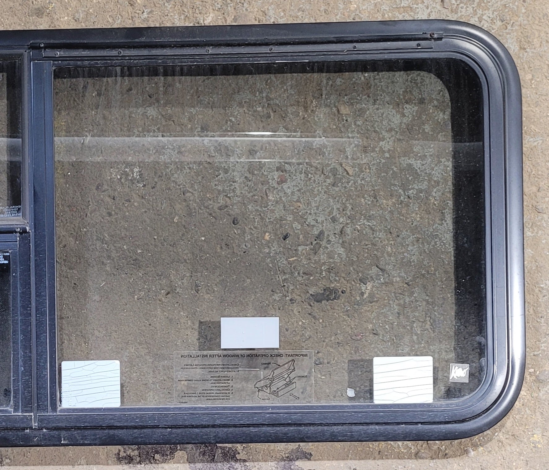 Used Black Radius Emergency Opening Window : 47 1/4" W x 21 1/4" H x 1 3/4" - Young Farts RV Parts