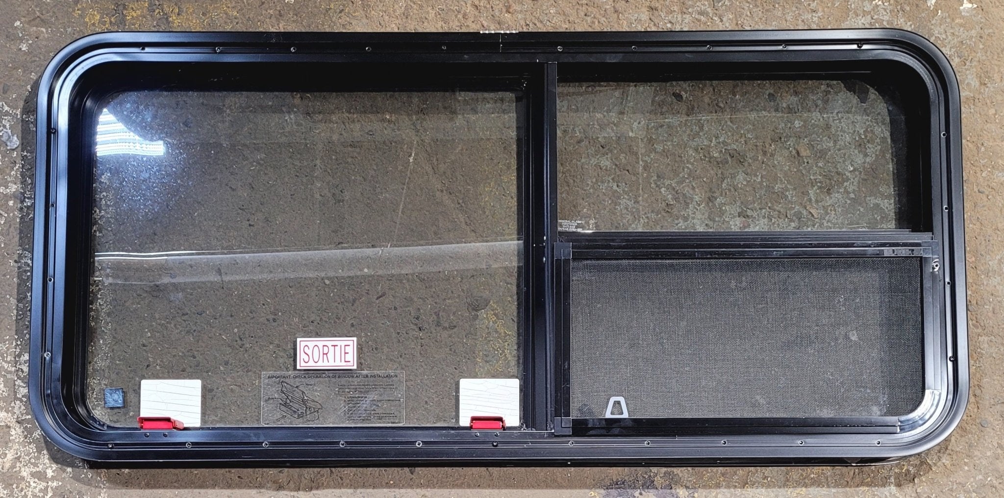 Used Black Radius Emergency Opening Window : 47 1/4" W x 21 1/4" H x 1 3/4" - Young Farts RV Parts