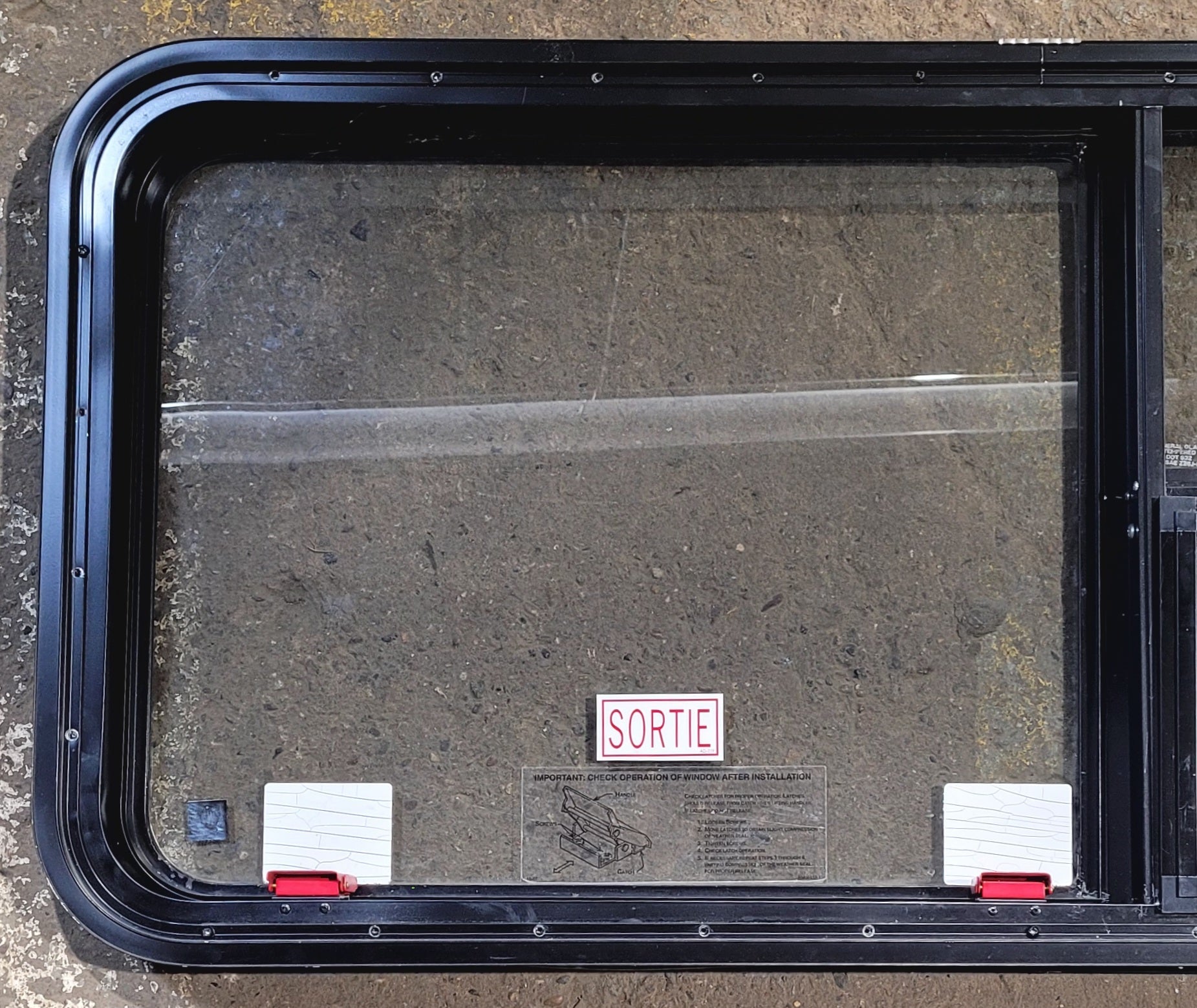 Used Black Radius Emergency Opening Window : 47 1/4" W x 21 1/4" H x 1 3/4" - Young Farts RV Parts