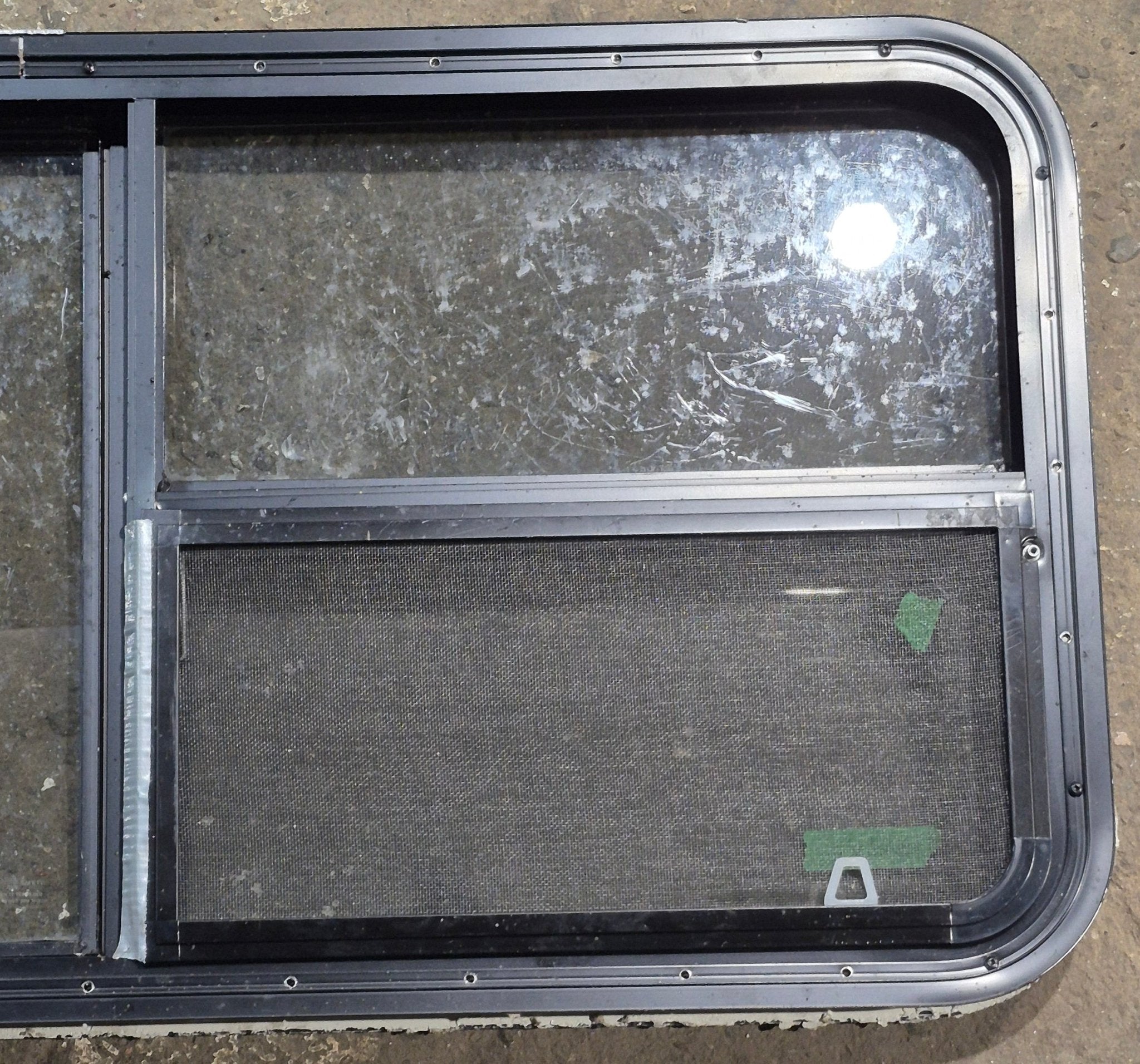 Used Black Radius Emergency Opening Window : 47 1/4" W x 21 1/4" H x 1 3/4" D - Young Farts RV Parts