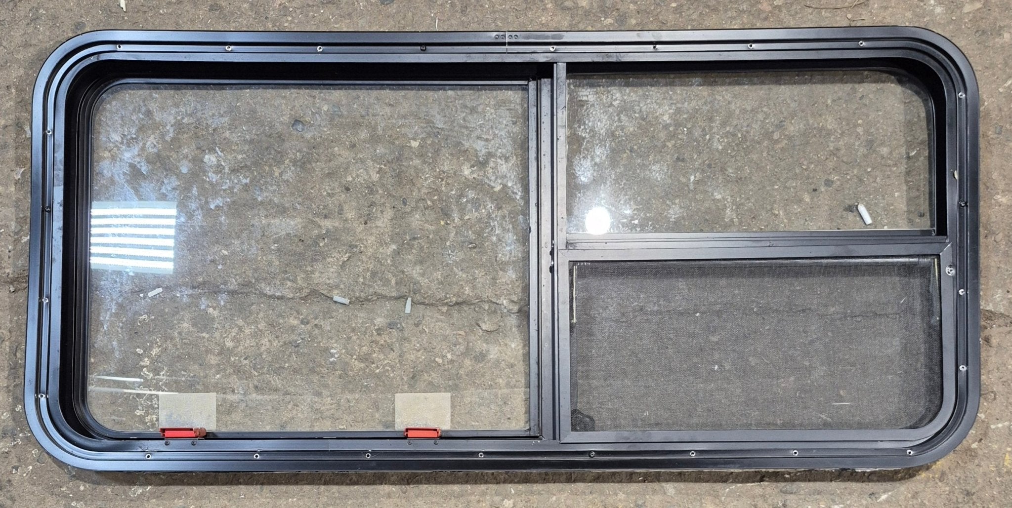 Used Black Radius Emergency Opening Window : 47 1/4" W x 21 1/4" H x 1 7/8" - Young Farts RV Parts