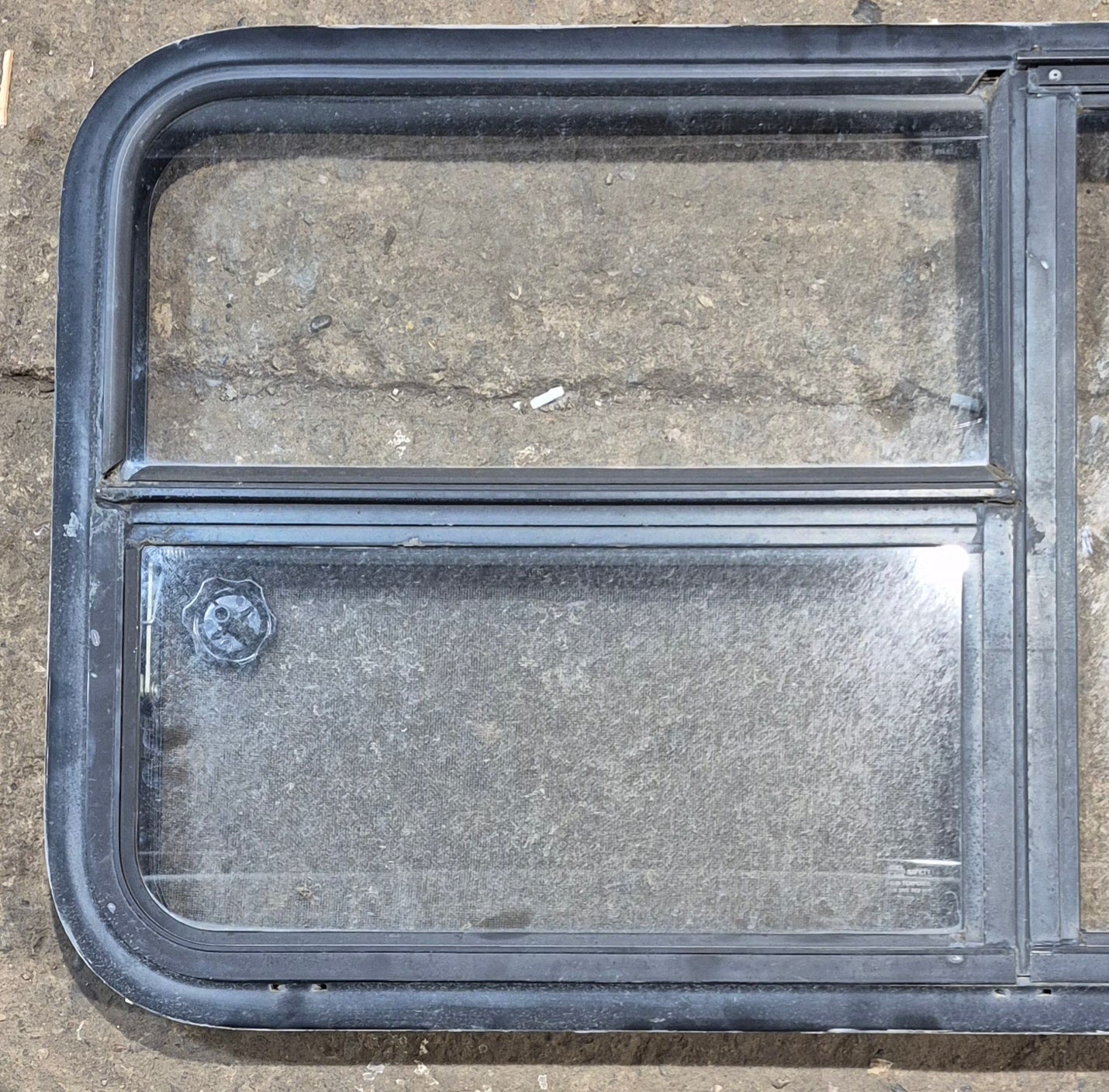 Used Black Radius Emergency Opening Window : 47 1/4" W x 21 1/4" H x 1 7/8" - Young Farts RV Parts