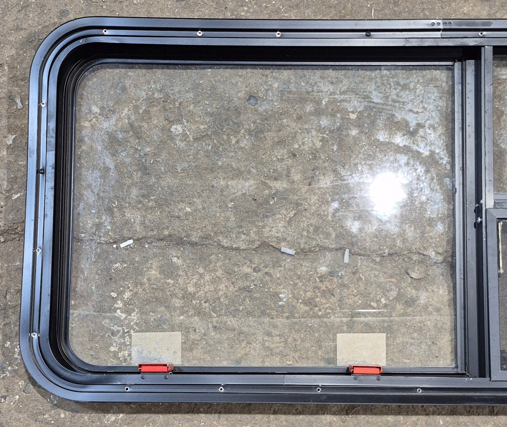 Used Black Radius Emergency Opening Window : 47 1/4" W x 21 1/4" H x 1 7/8" - Young Farts RV Parts