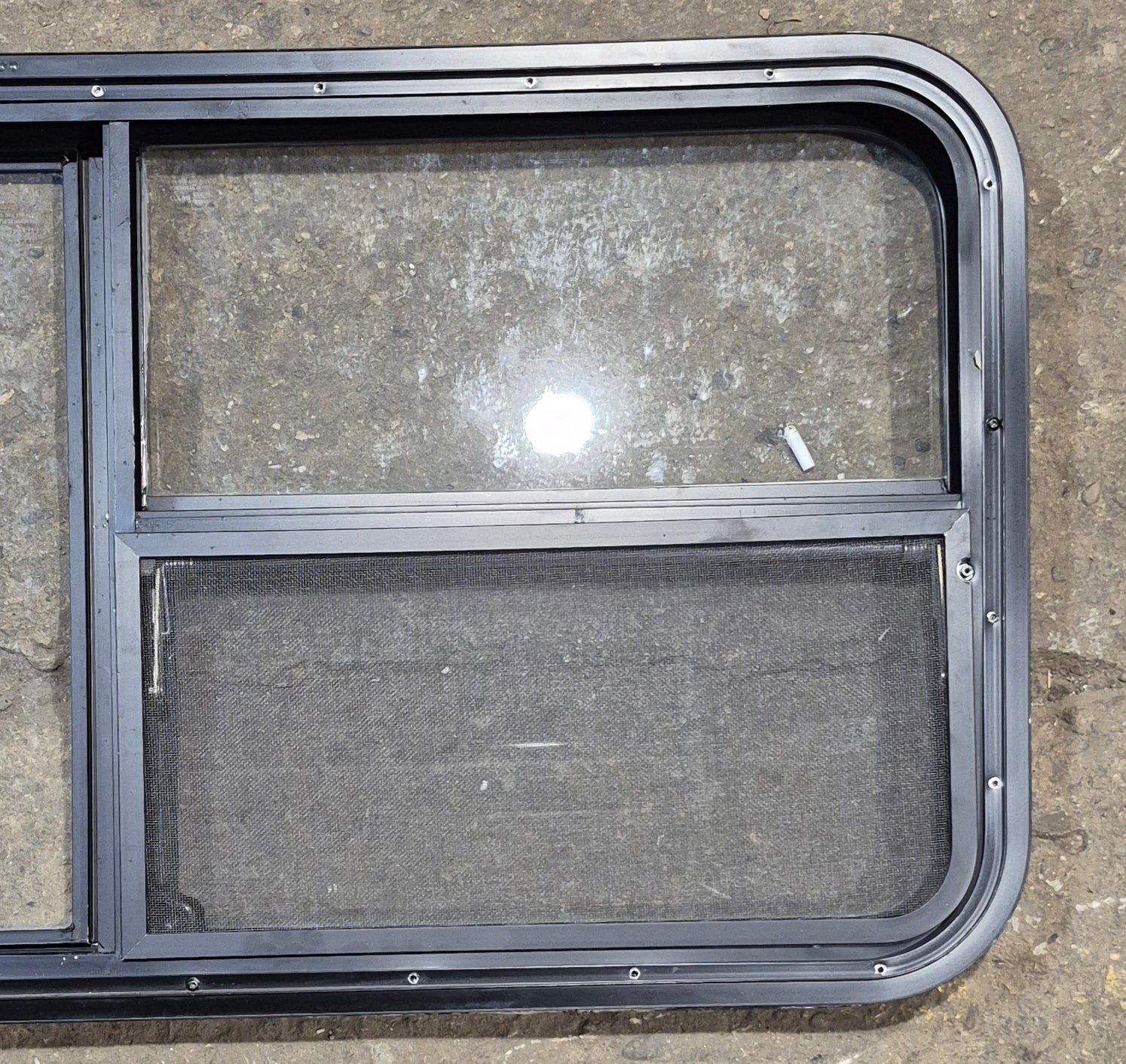 Used Black Radius Emergency Opening Window : 47 1/4" W x 21 1/4" H x 1 7/8" - Young Farts RV Parts