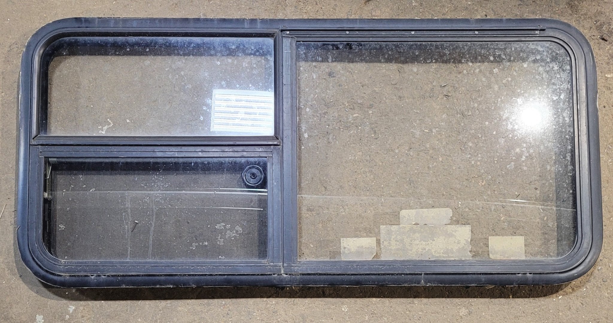 Used Black Radius Emergency Opening Window : 47 1/4" W x 21 1/4" H x 1 7/8" - Young Farts RV Parts