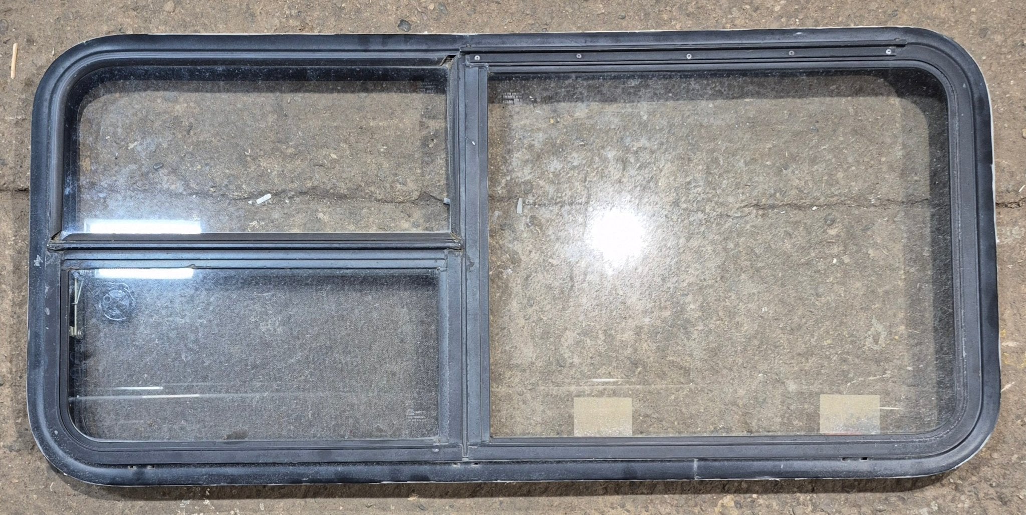 Used Black Radius Emergency Opening Window : 47 1/4" W x 21 1/4" H x 1 7/8" - Young Farts RV Parts